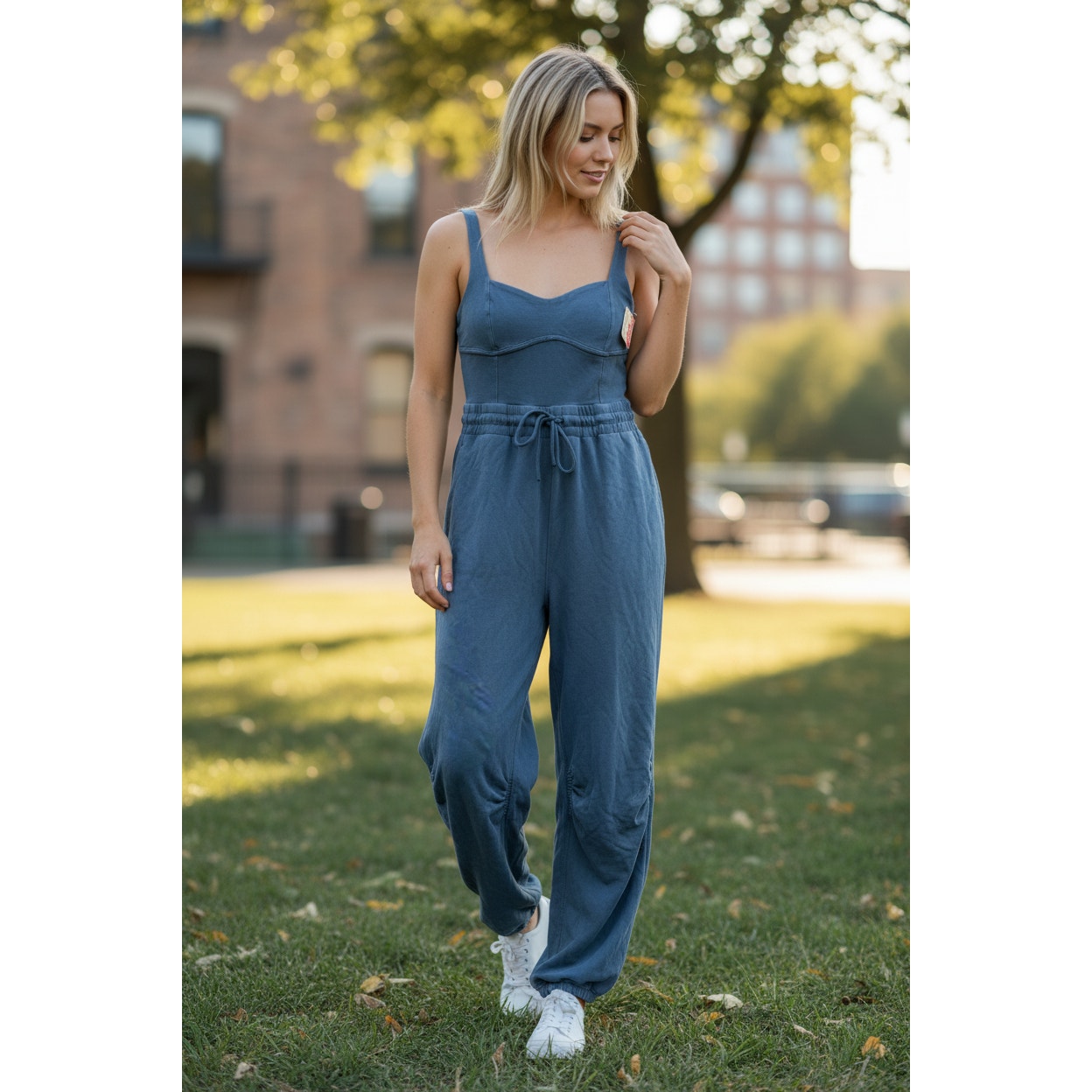 Women's Free People Movement jumpsuit in misty blue, medium size, stylish and comfortable one-piece outfit.