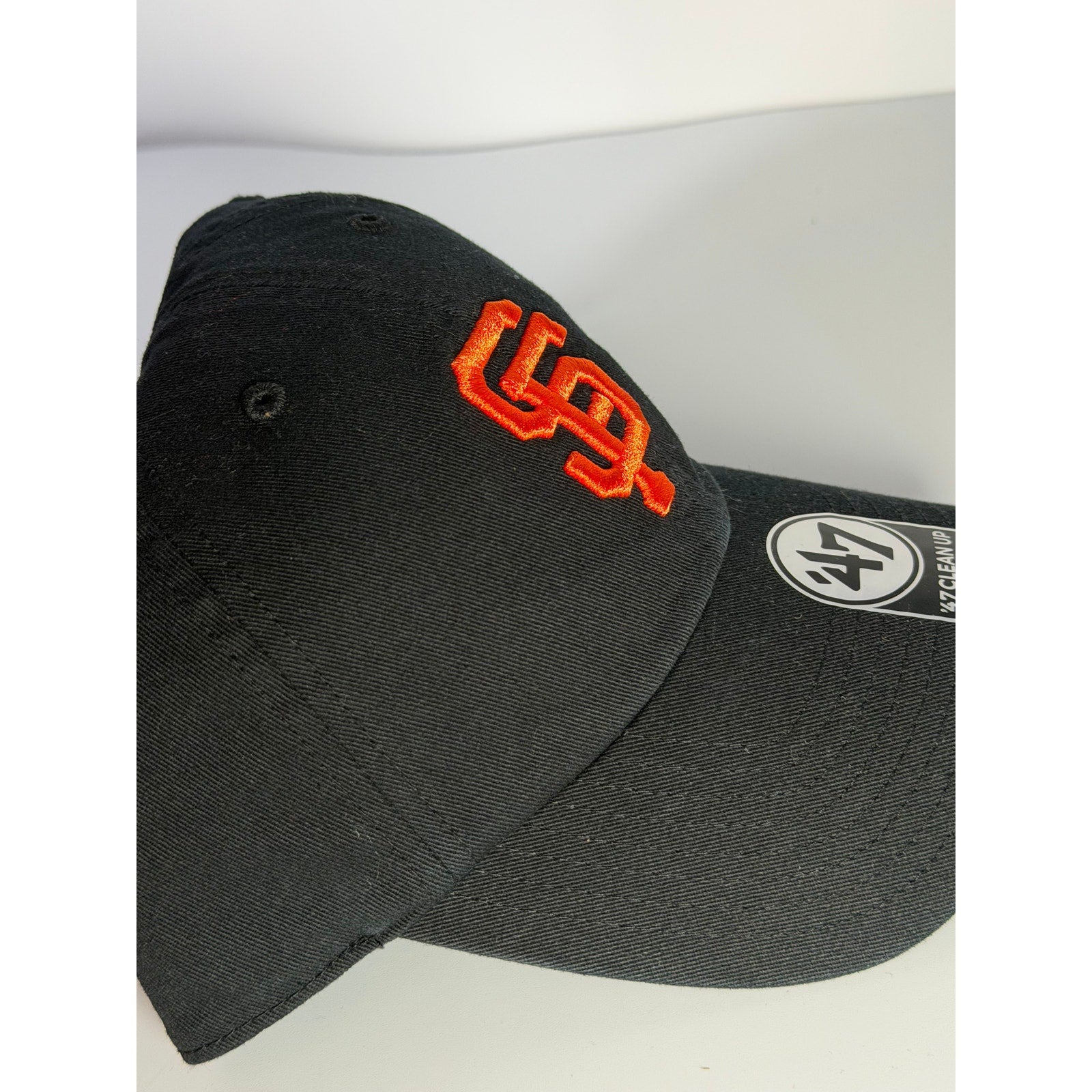 Black '47 San Francisco Giants Clean Up adjustable dad hat, showing the front logo and adjustable strap detail.