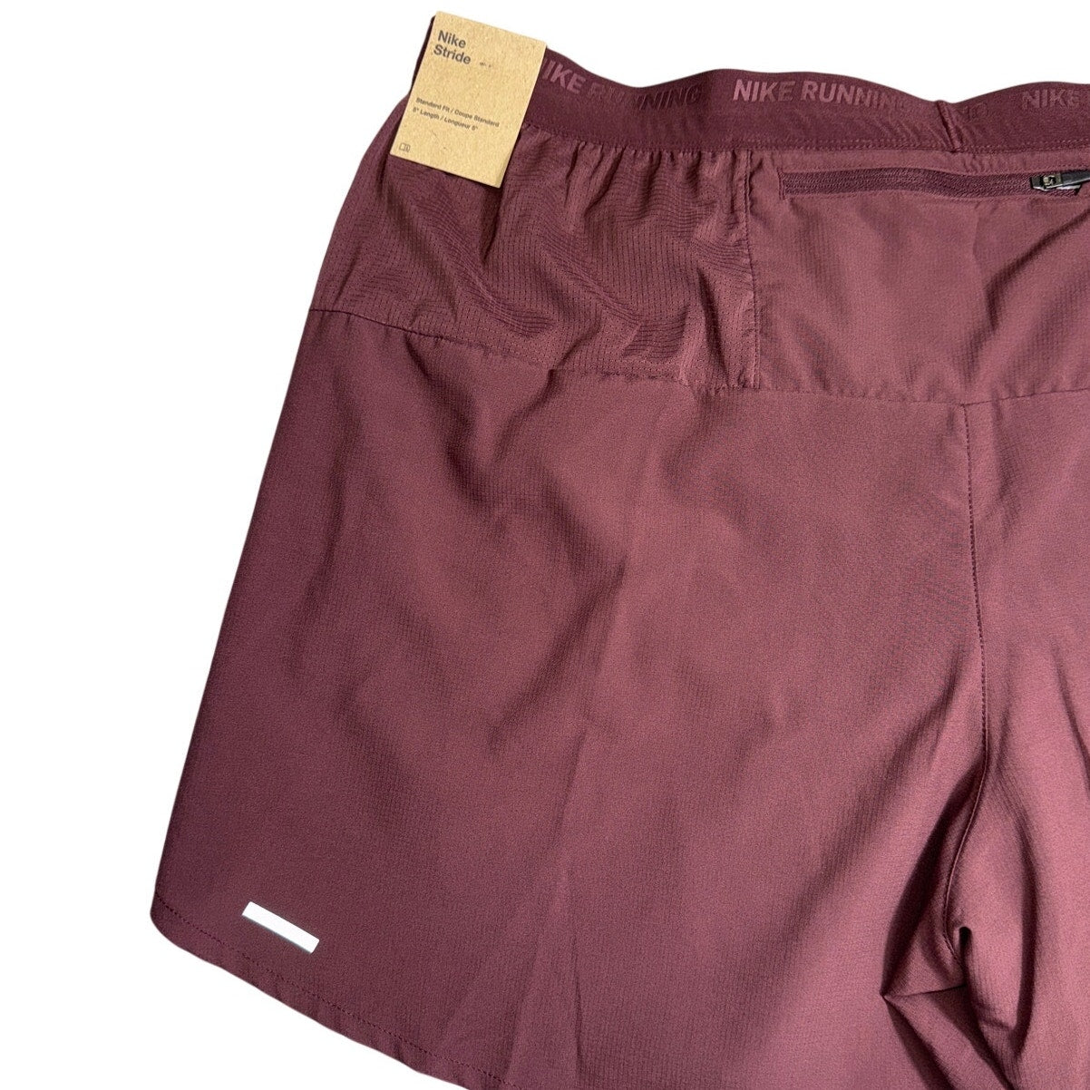 Men's Nike Stride Dri-FIT 5-inch running shorts in burgundy crush, size XXL, lightweight athletic design with Nike branding.