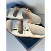 Cole Haan women's white leather buckle slide sandals, US size 9B, new in box, featuring a stylish open-toe design.