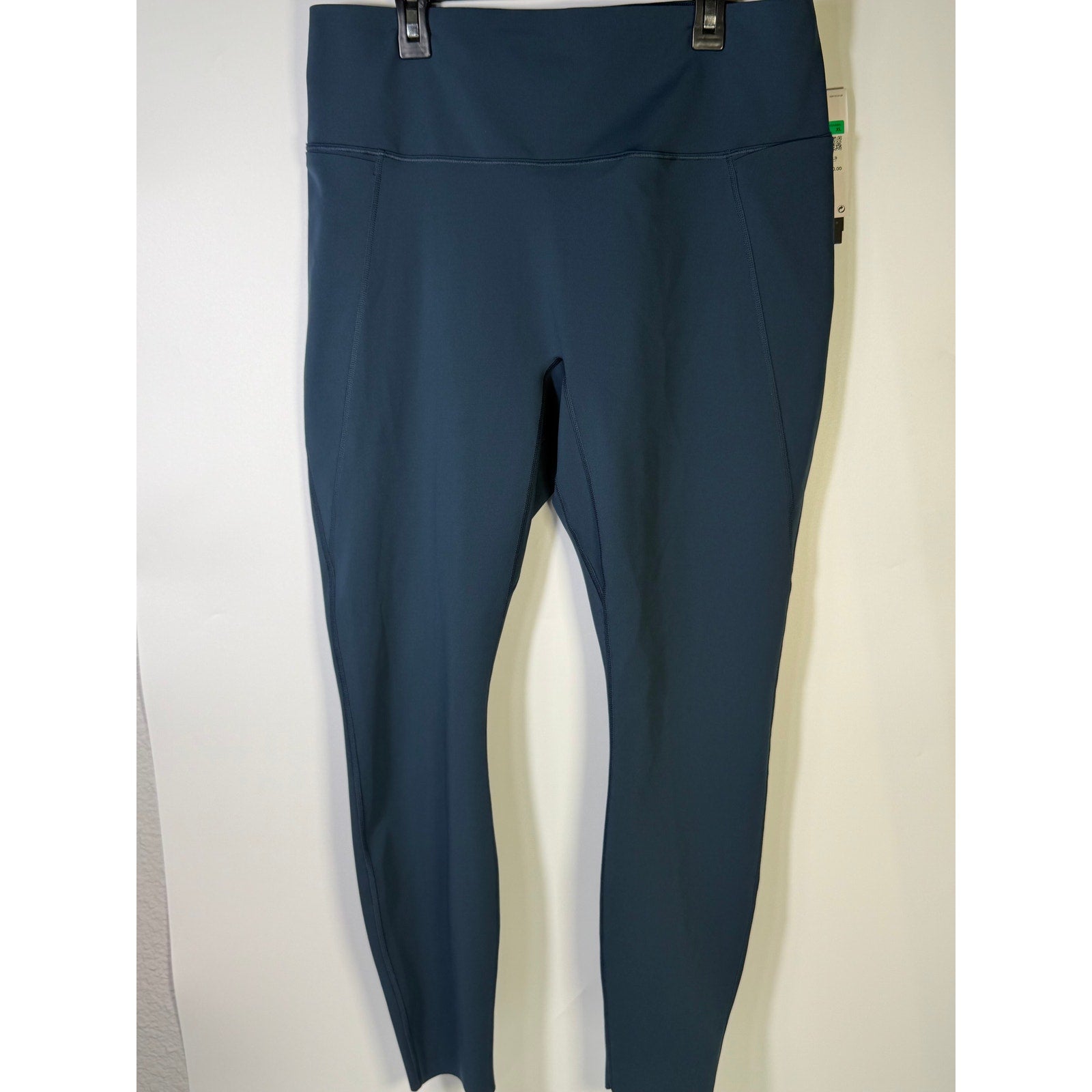 Nike women's blue high-waisted training leggings in size XL, featuring a snug fit and comfortable stretch for active wear.