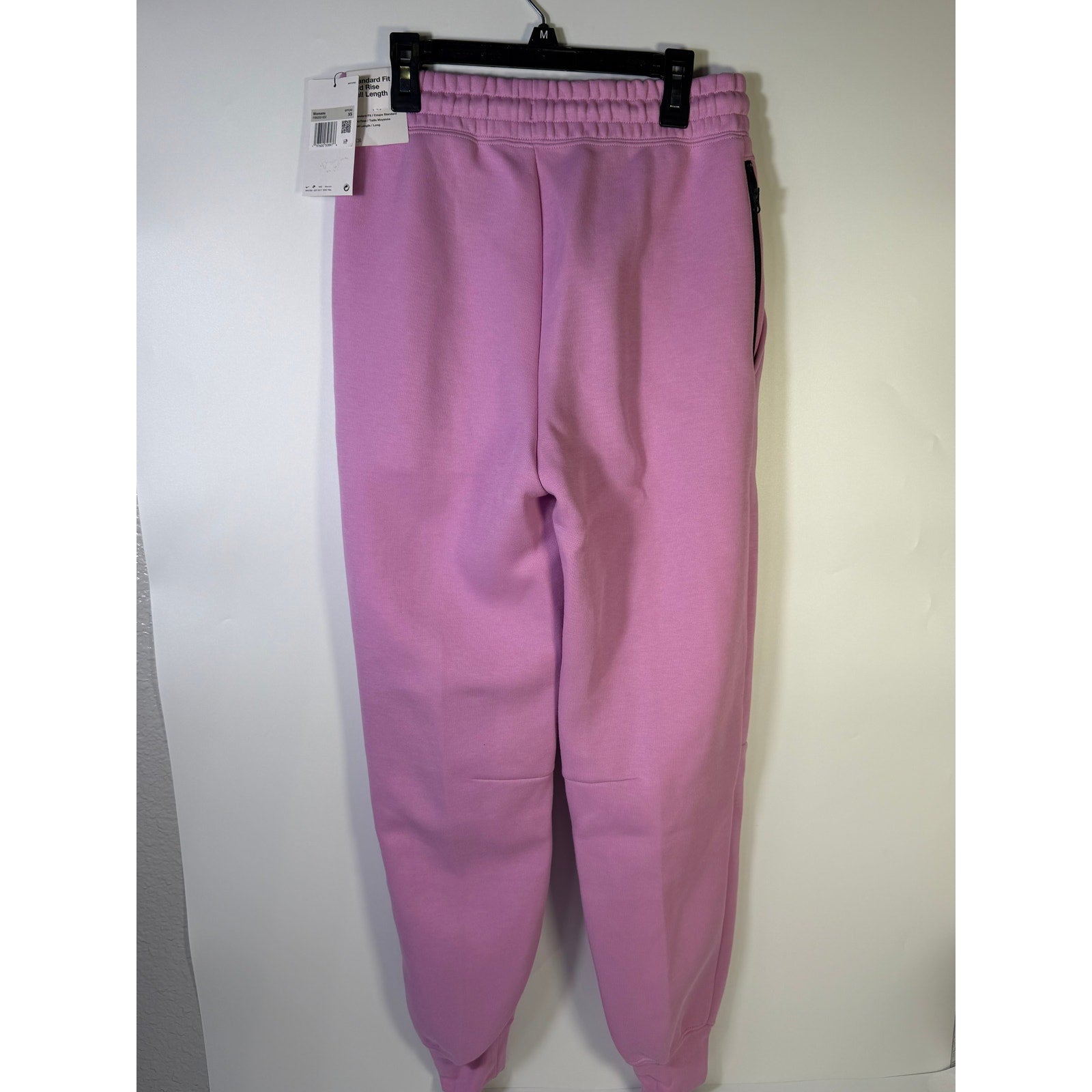 Nike Sportswear Phoenix fleece jogger sweatpants for women in pink, mid-rise, XS size, with a comfortable relaxed fit.