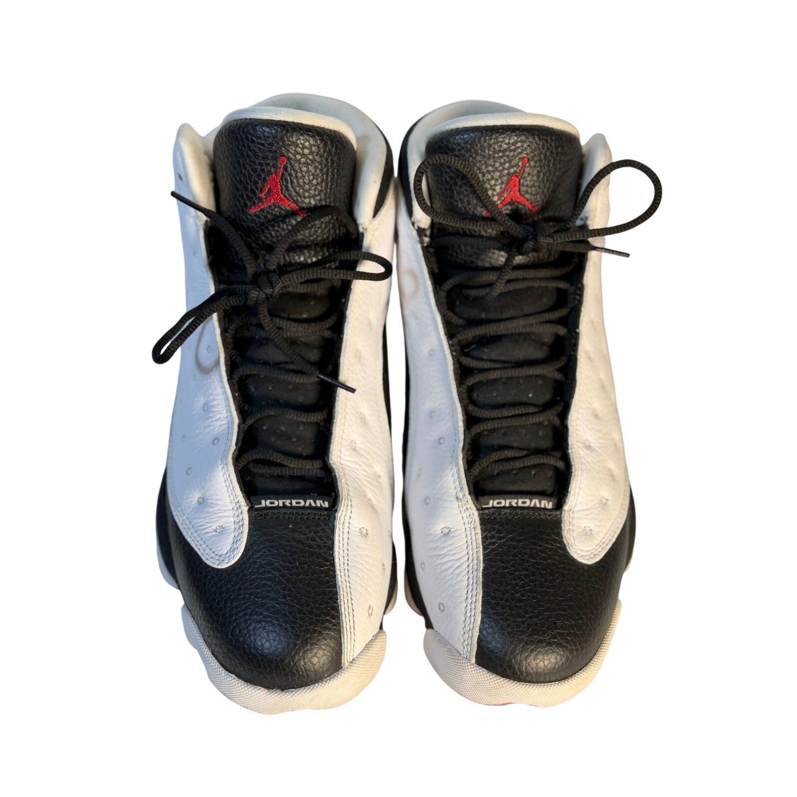 Men's Air Jordan 13 Retro He Got Game black and white athletic sneakers, size US 11.5, with distinctive design and Jordan branding.