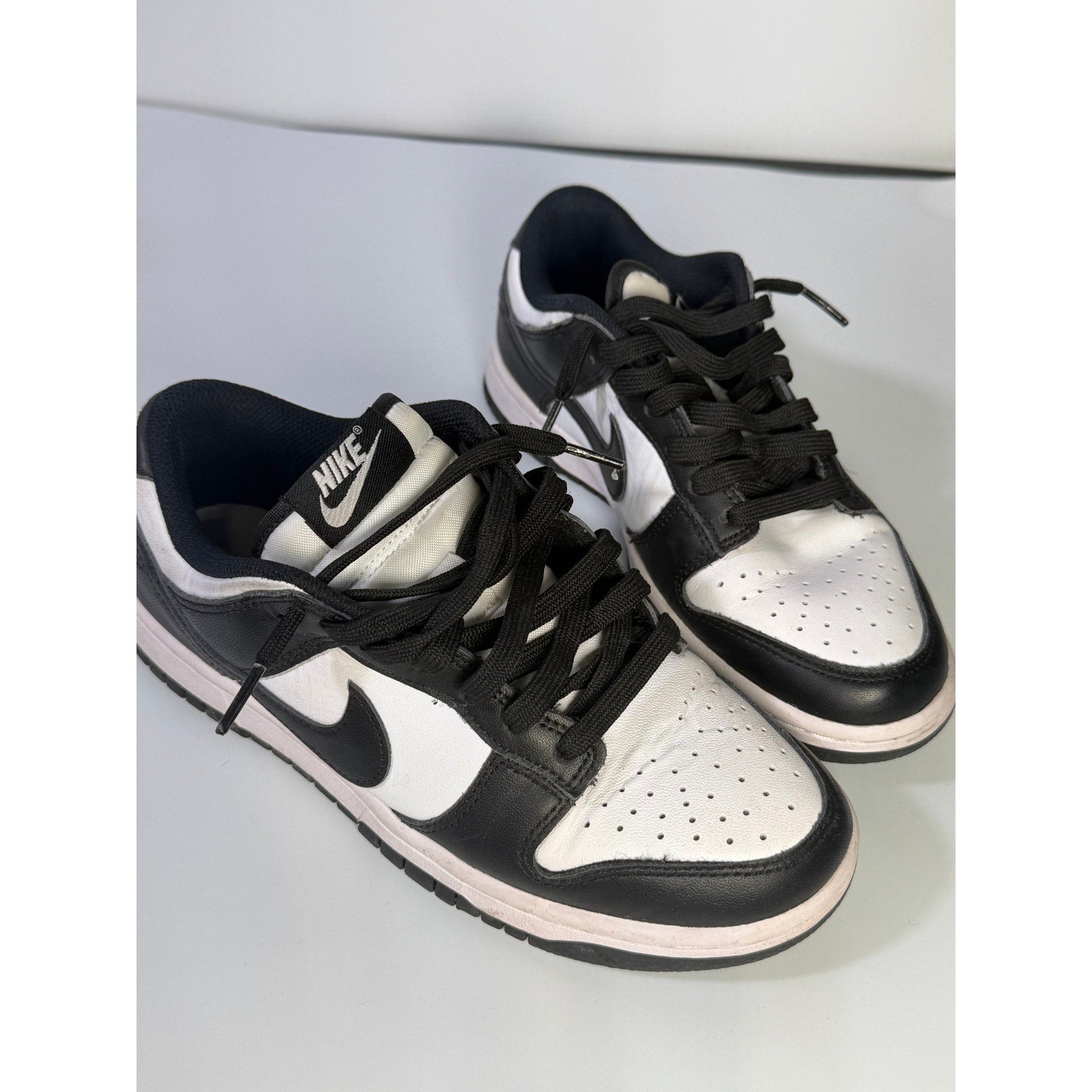 Nike Dunk Low Panda sneakers for youth, size 5Y, black and white leather shoes with iconic Nike branding.