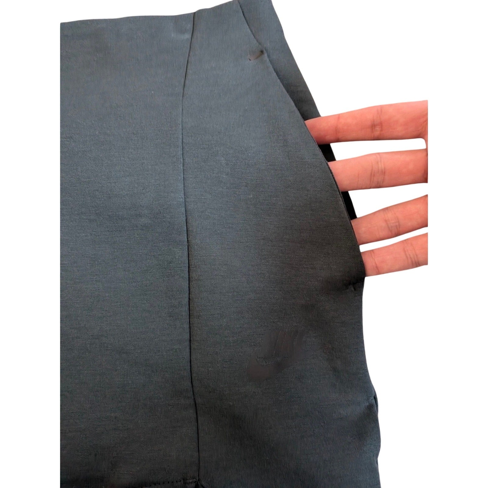 Nike women's slim fit knee-length athletic skirt in small size, shown in black with athletic design and comfortable fit.