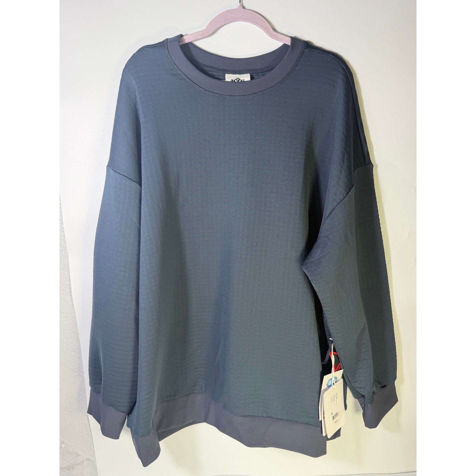 Women's Obermeyer Explorer Tech Crew Pullover Sweatshirt in blue nights, showing the front view with a crew neckline and long sleeves.