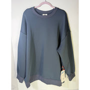 Women's Obermeyer Explorer Tech Crew Pullover Sweatshirt in blue nights, showing the front view with a crew neckline and long sleeves.