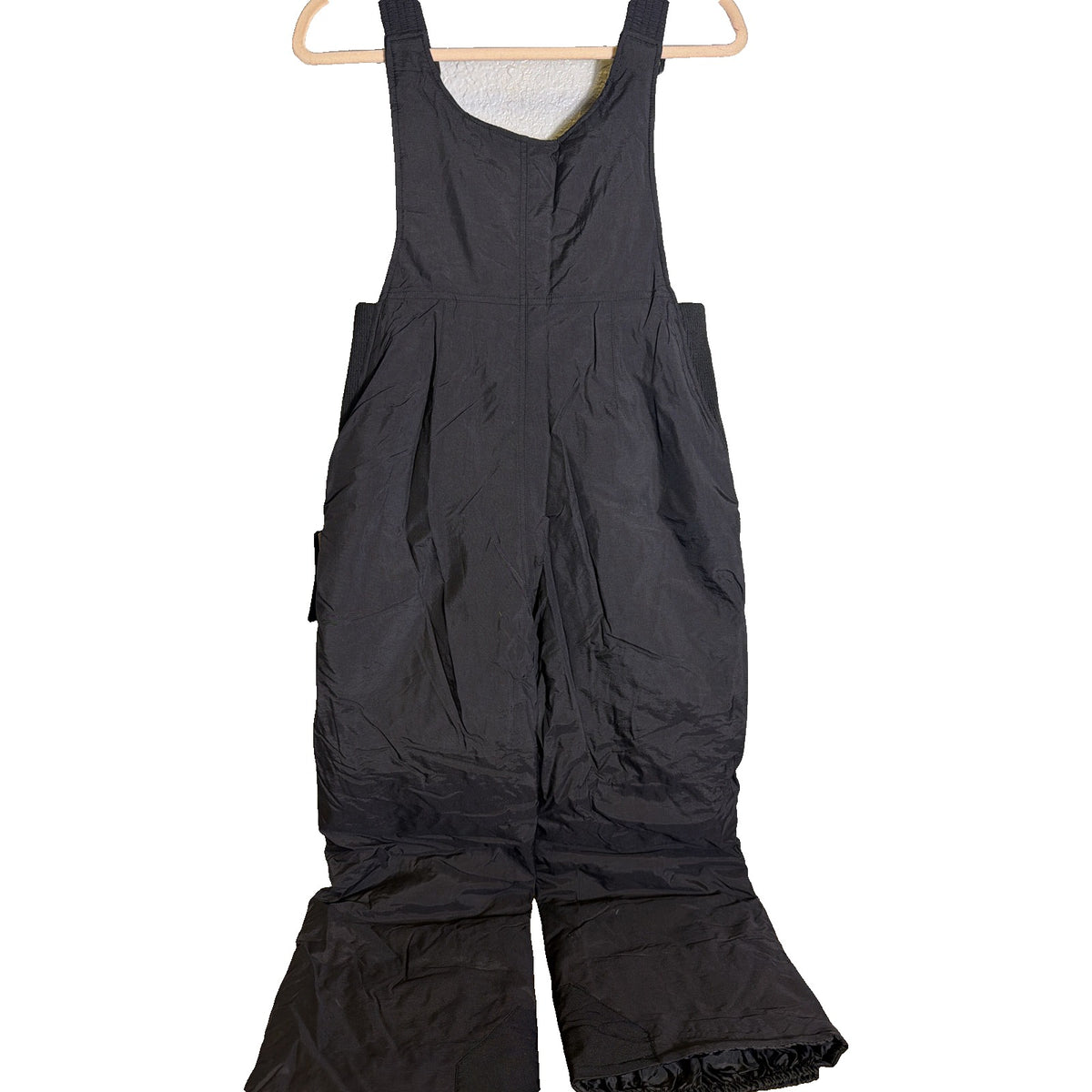 Black insulated youth snow pants from Outdoor Gear, Peak Bib ski overalls for kids, size L, featuring adjustable straps and snow-resistant fabric.