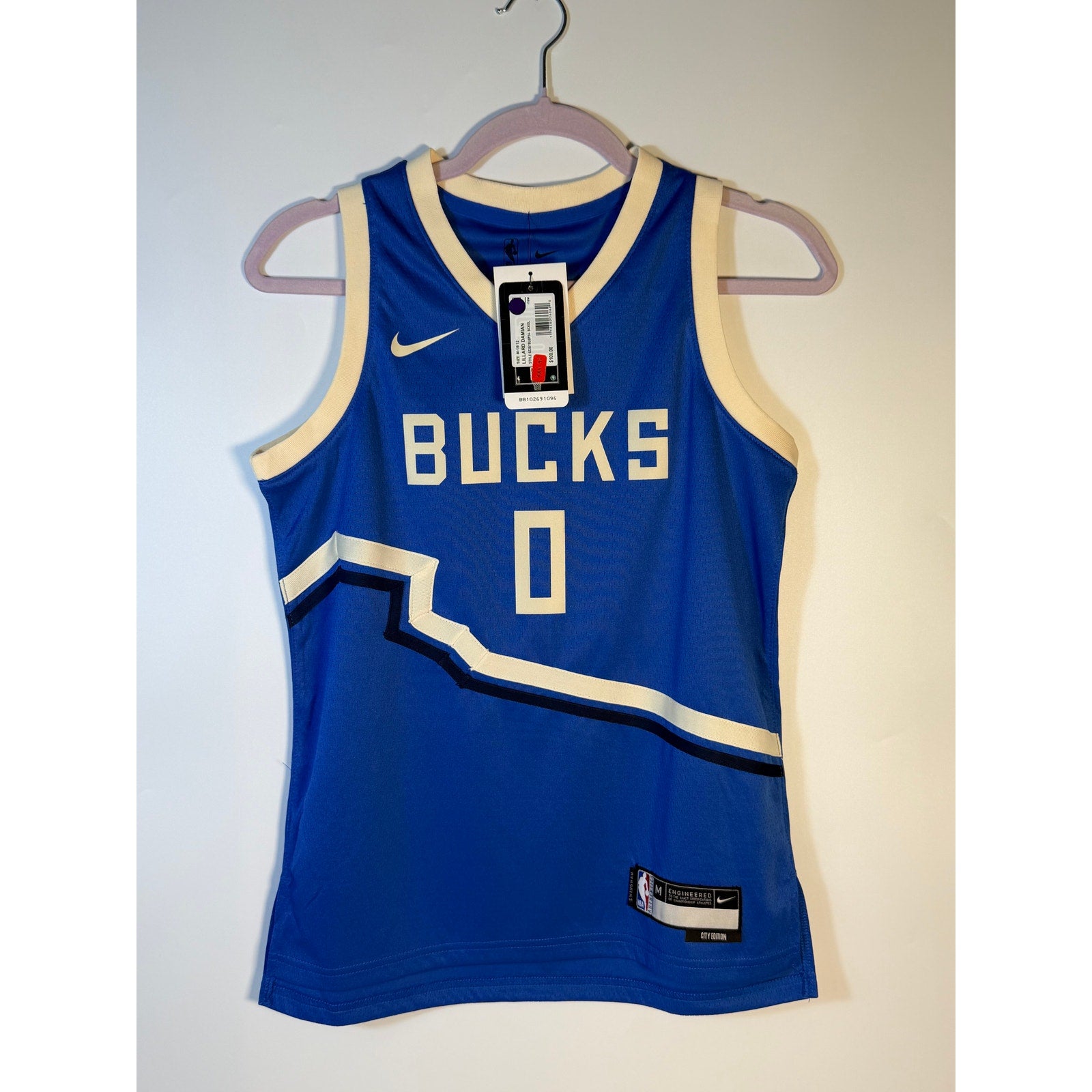 Nike Milwaukee Bucks Damian Lillard #0 City Edition youth jersey, size M 10/12, new with vibrant Bucks team colors and logo.