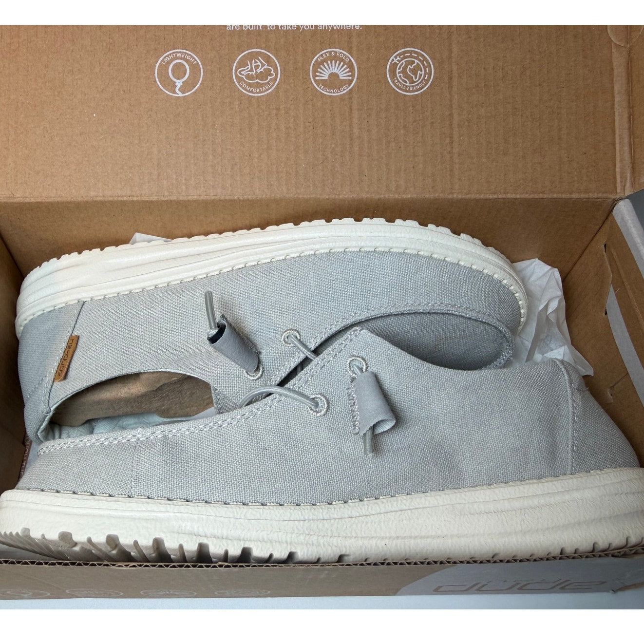 Hey Dude Wendy Chambray women's sneakers in light grey, size 8, with casual lace-up design and comfortable fabric upper.