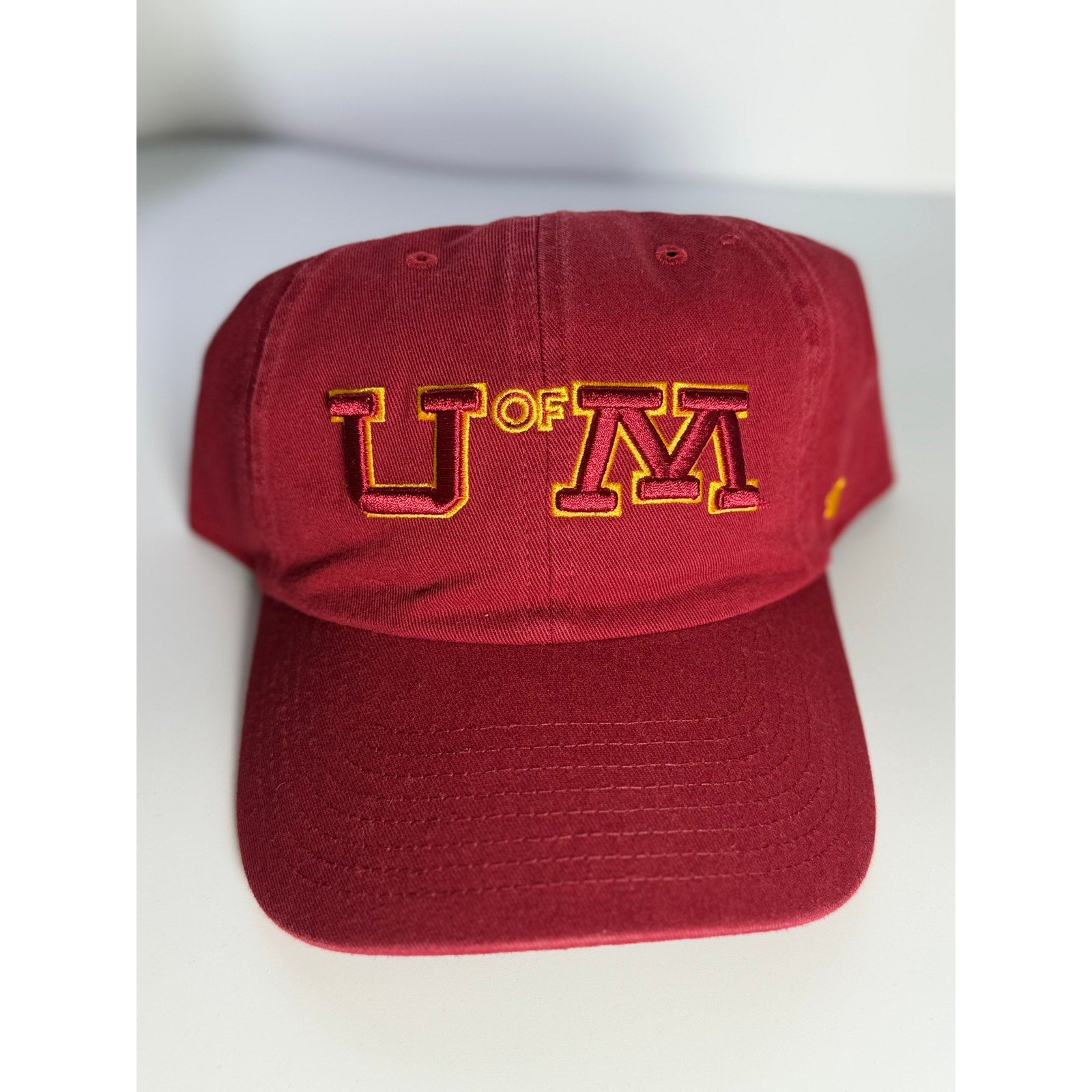 Maroon and gold '47 University of Minnesota U of M adjustable dad hat with embroidered logo and OSFM fit.