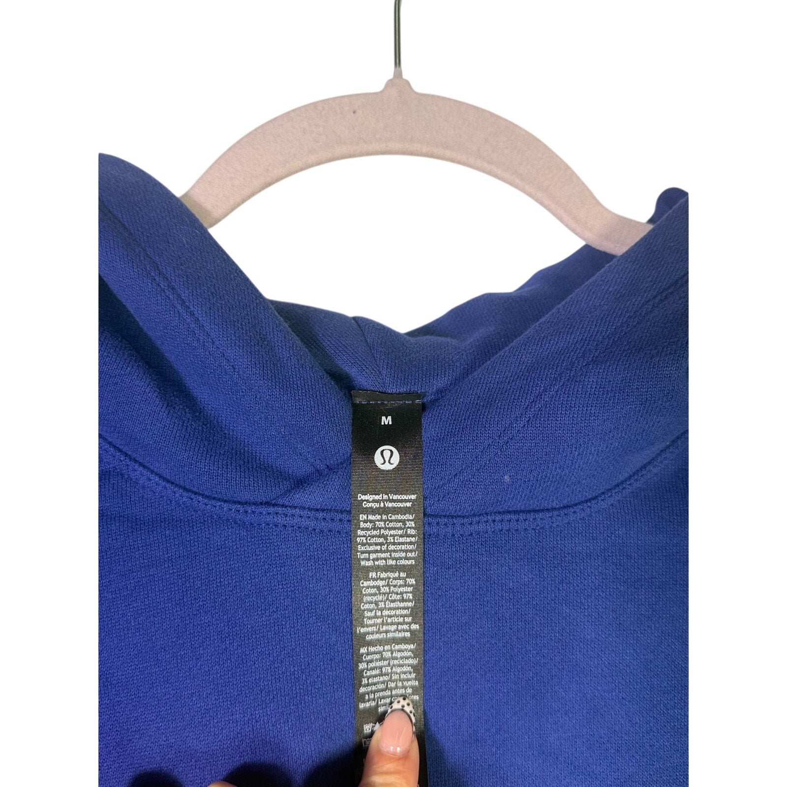 Lululemon women's blue For All Runners graphic hoodie, size M, showing front view with hood and printed design.