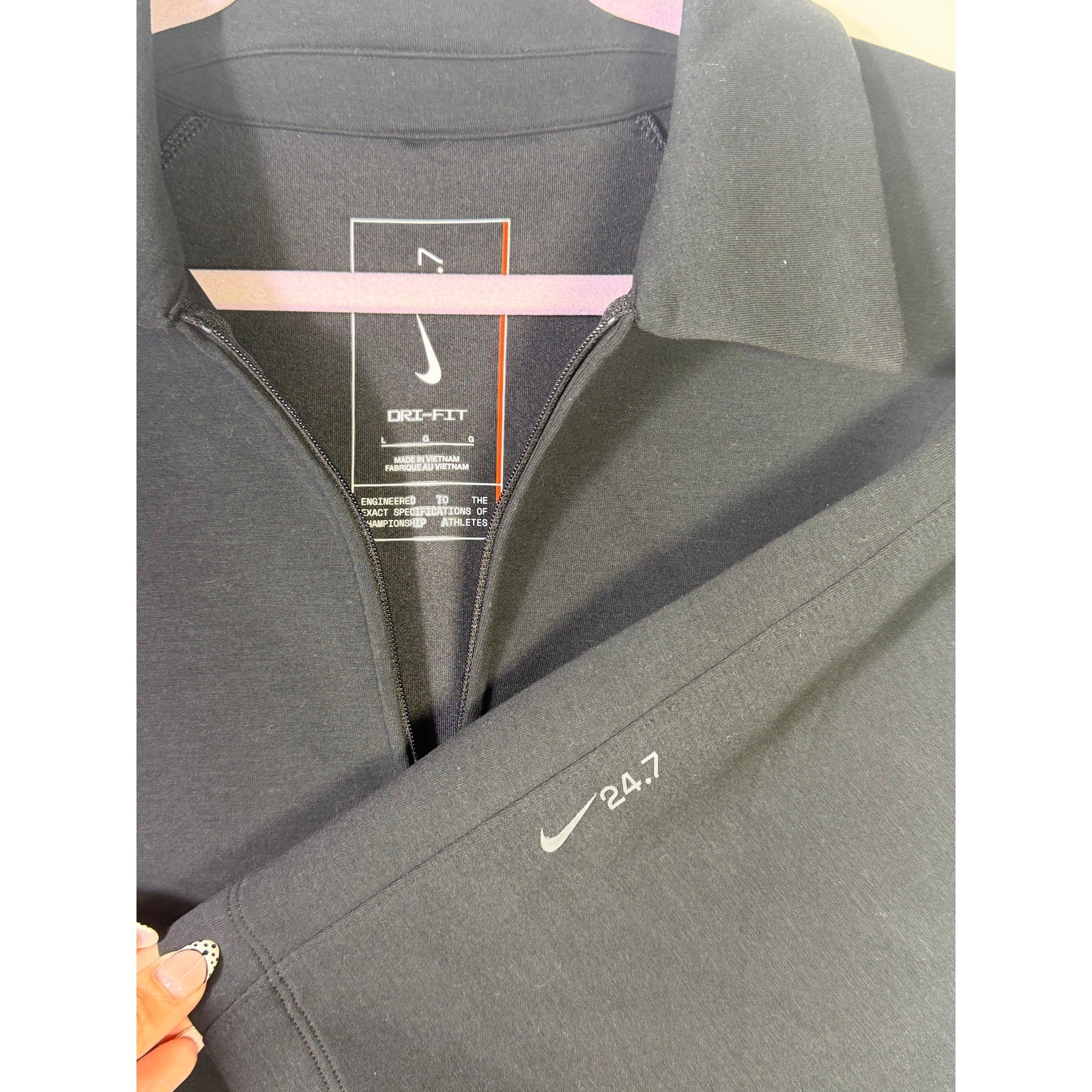 Nike Dri-FIT men's black 1/4 zip golf polo shirt, size large, displayed flat with short sleeves and Nike logo detail.