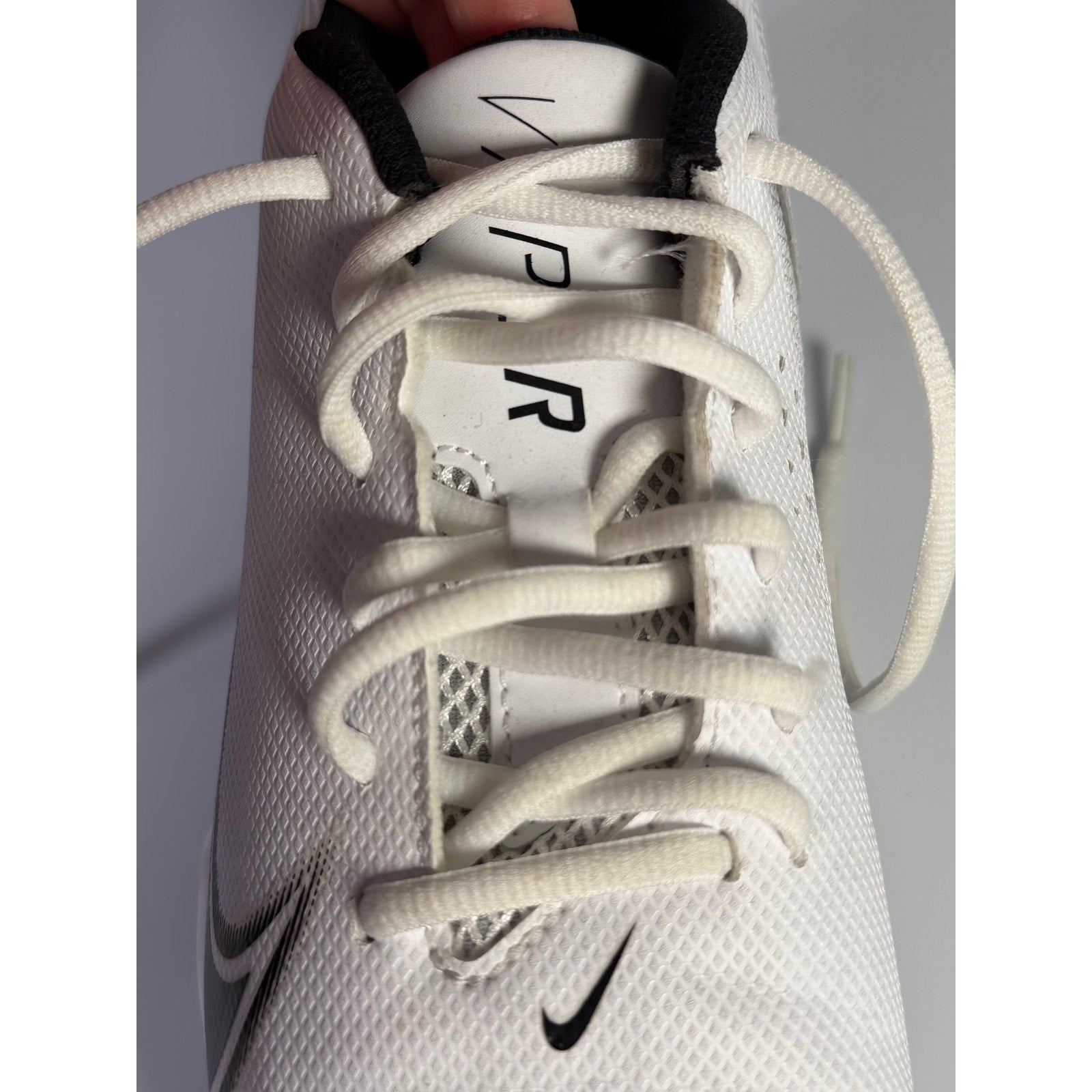 Nike Vapor football cleats in white and black for men, size 8.5 US, featuring a sleek design and athletic sole.