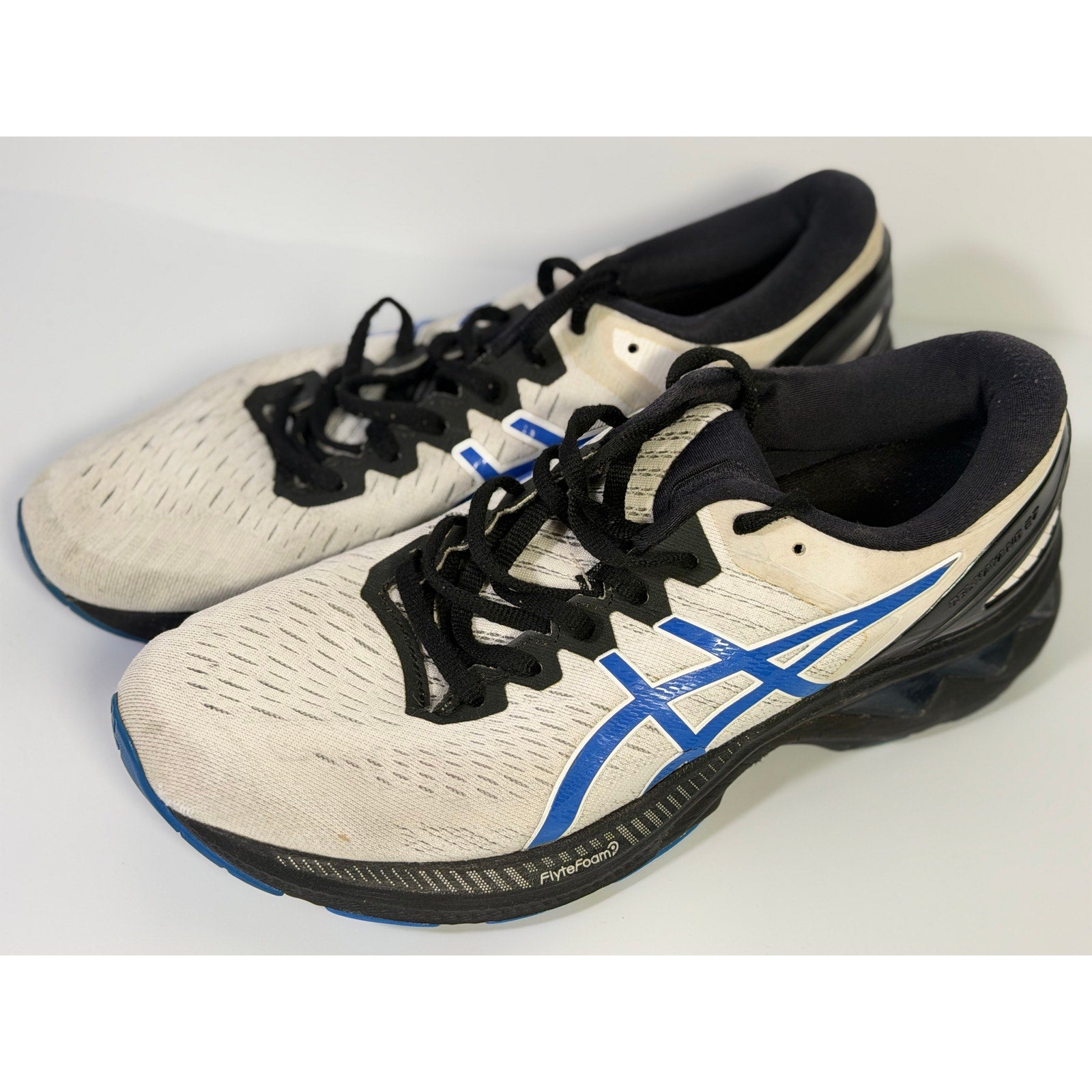 Men's ASICS Gel Cumulus 24 running sneakers in white, blue, and black with cushioned athletic design, US 8.5/EU 42.