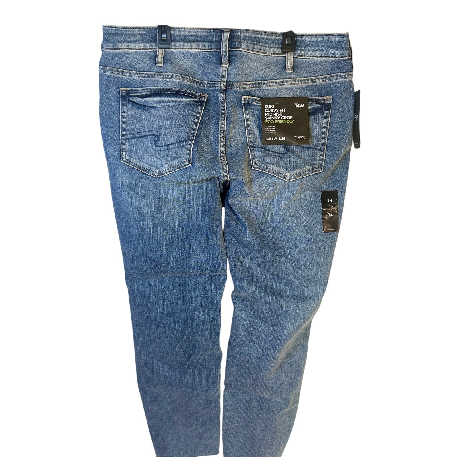 Silver Jeans Co. Suki curvy fit mid-rise skinny crop jeans for women, size 14W, showing the denim fabric and stylish fit.
