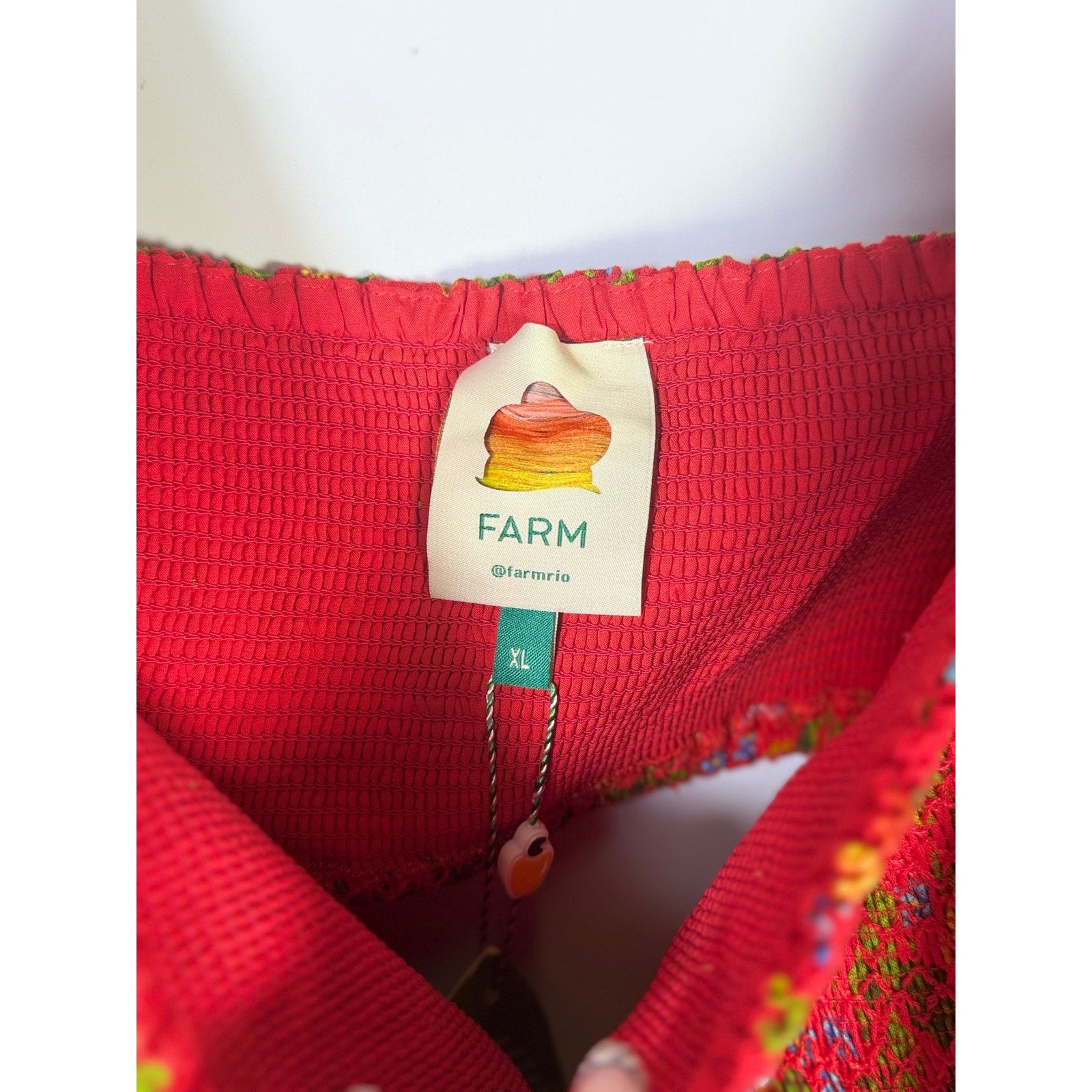 Red floral embroidered FARM Rio women's romper with flutter sleeves, size XL, featuring vibrant floral patterns and casual style.