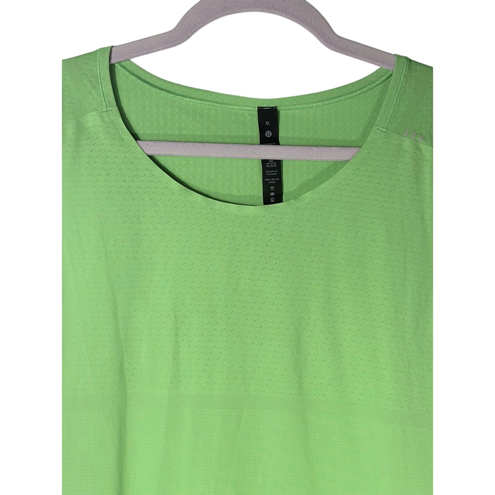Lululemon women's lime green open-back athletic tank top in size XL, lightweight and breathable for active wear.
