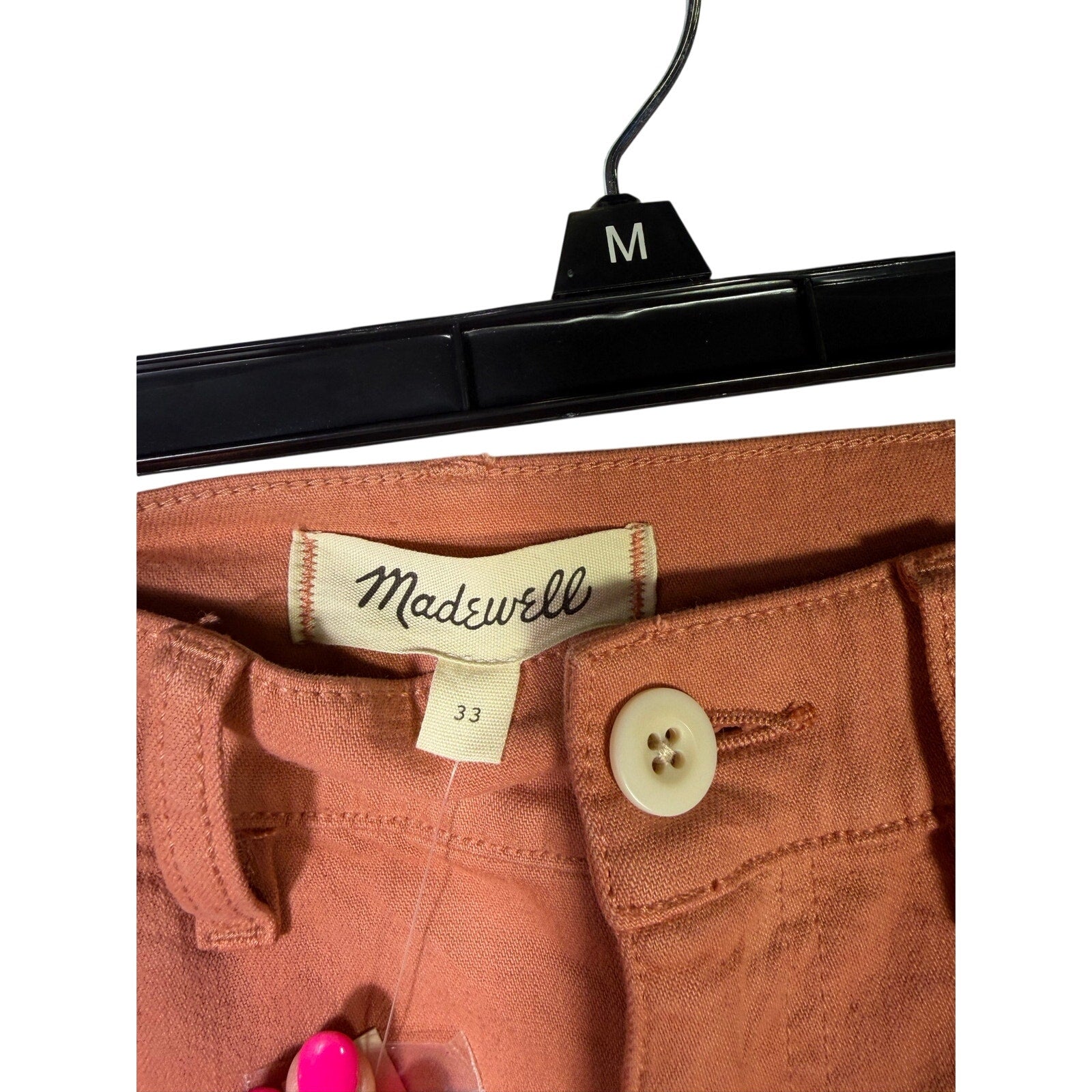 Madewell The Perfect Vintage wide-leg crop pants in terracotta, size 33, displayed on a hanger with a neutral background.