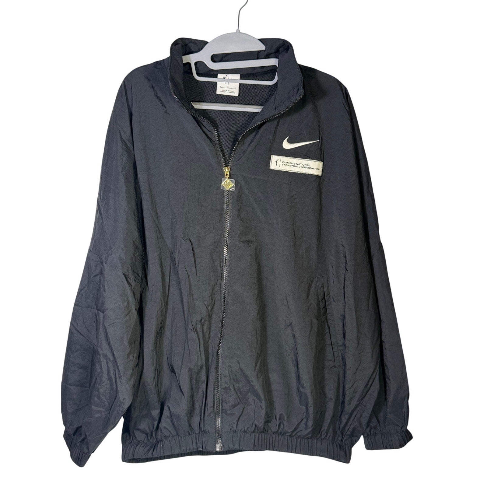 Nike women's WNBA windbreaker jacket in black, size M, full zip, lightweight mesh-lined jacket with branded details.