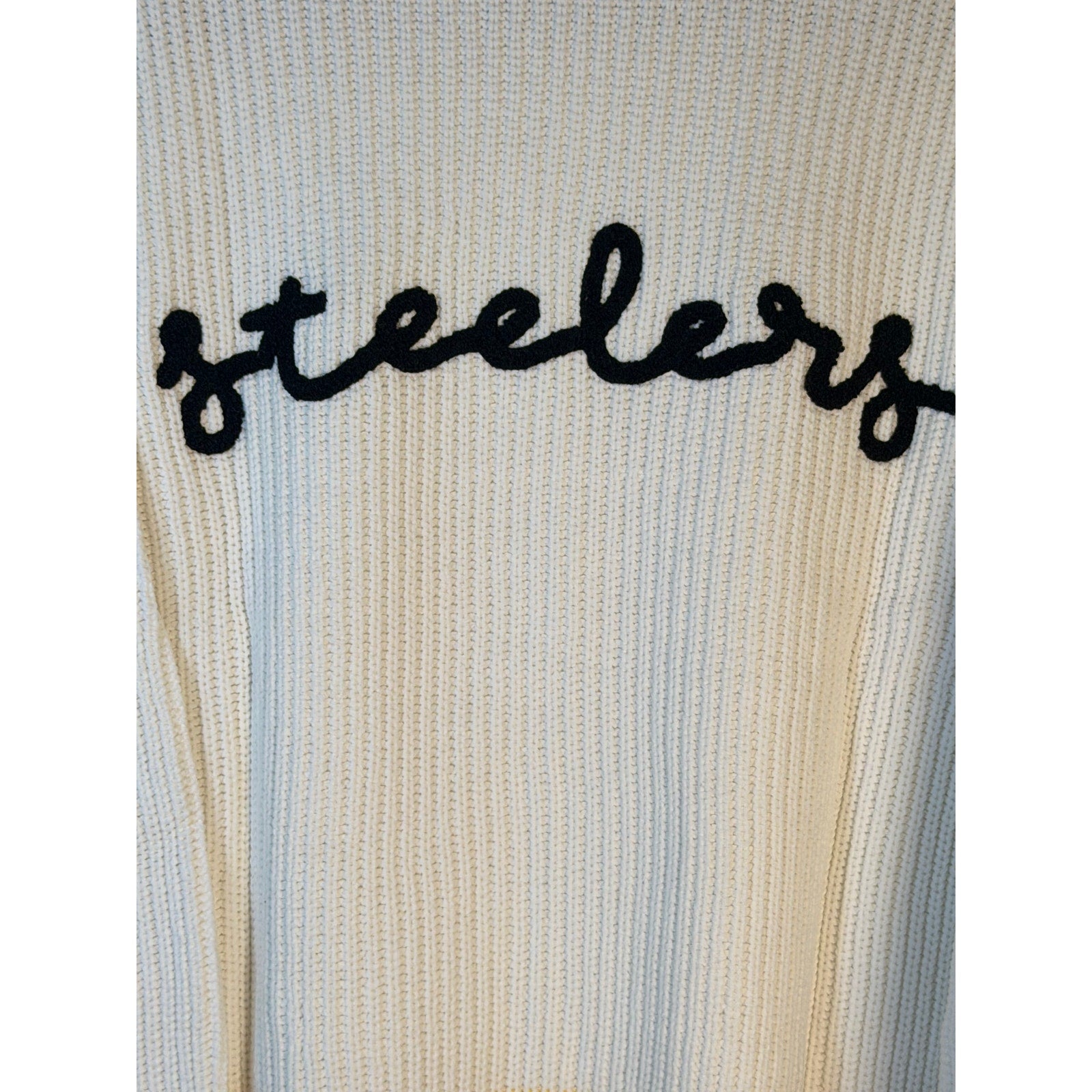 Women’s Pittsburgh Steelers knit sweater by Wear by Erin Andrews, featuring team logo and cozy design, size M/M.