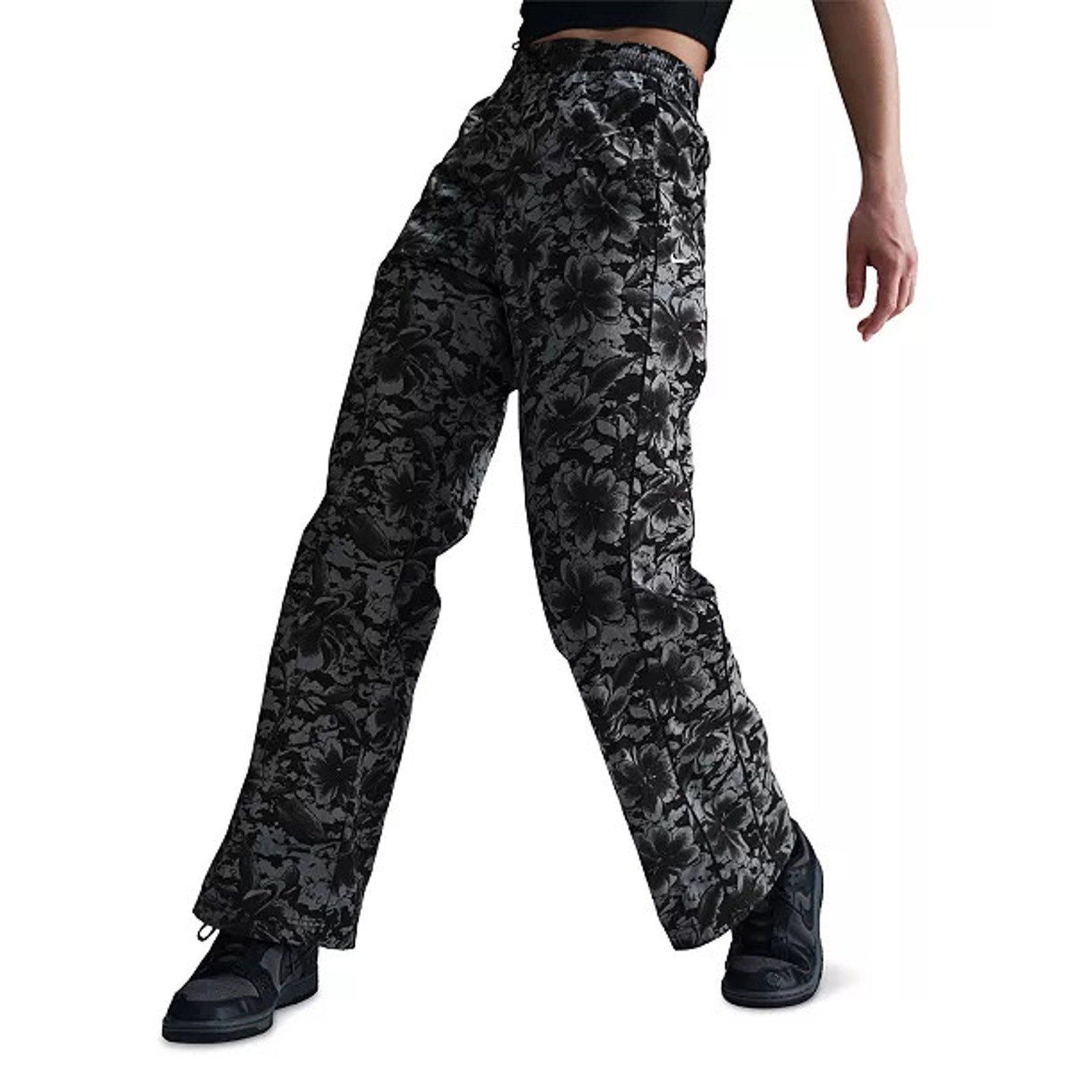 Nike Sportswear women's floral wide-leg track pants in black and gray with a high-rise fit, casual and stylish athletic pants