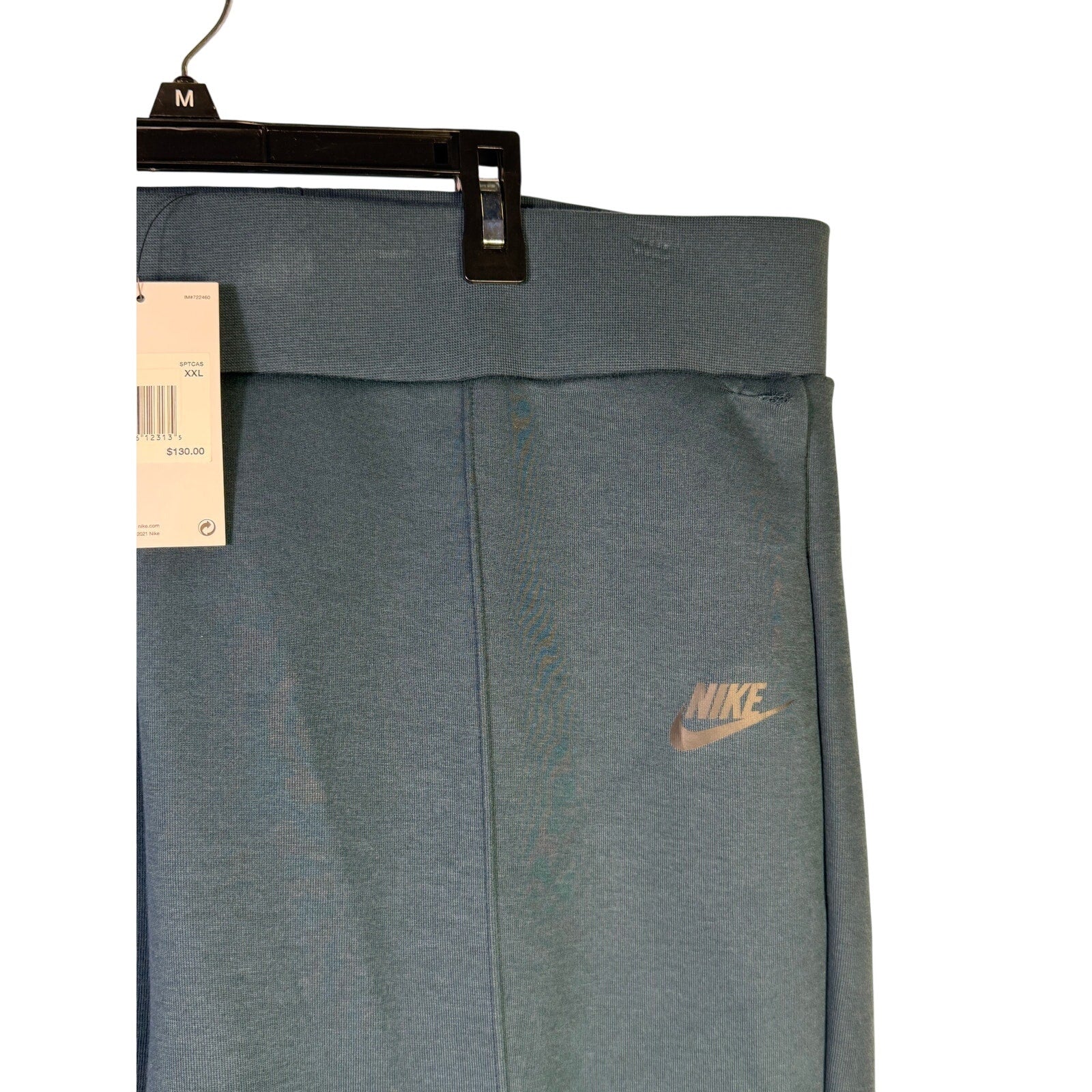 Nike Sportswear Tech Fleece high-waisted slim women's sweatpants in armory navy, XXL size, showing the fitted style and fleece material.