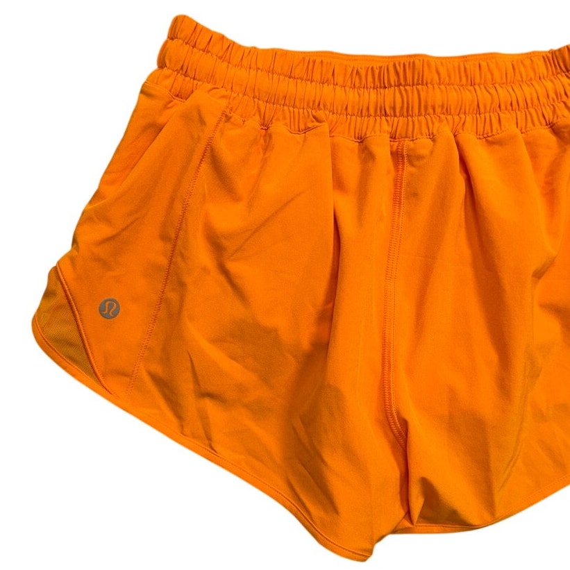 Lululemon Athletica Hotty Hot low-rise 2.5-inch lined athletic shorts for women, shown in a natural pose.