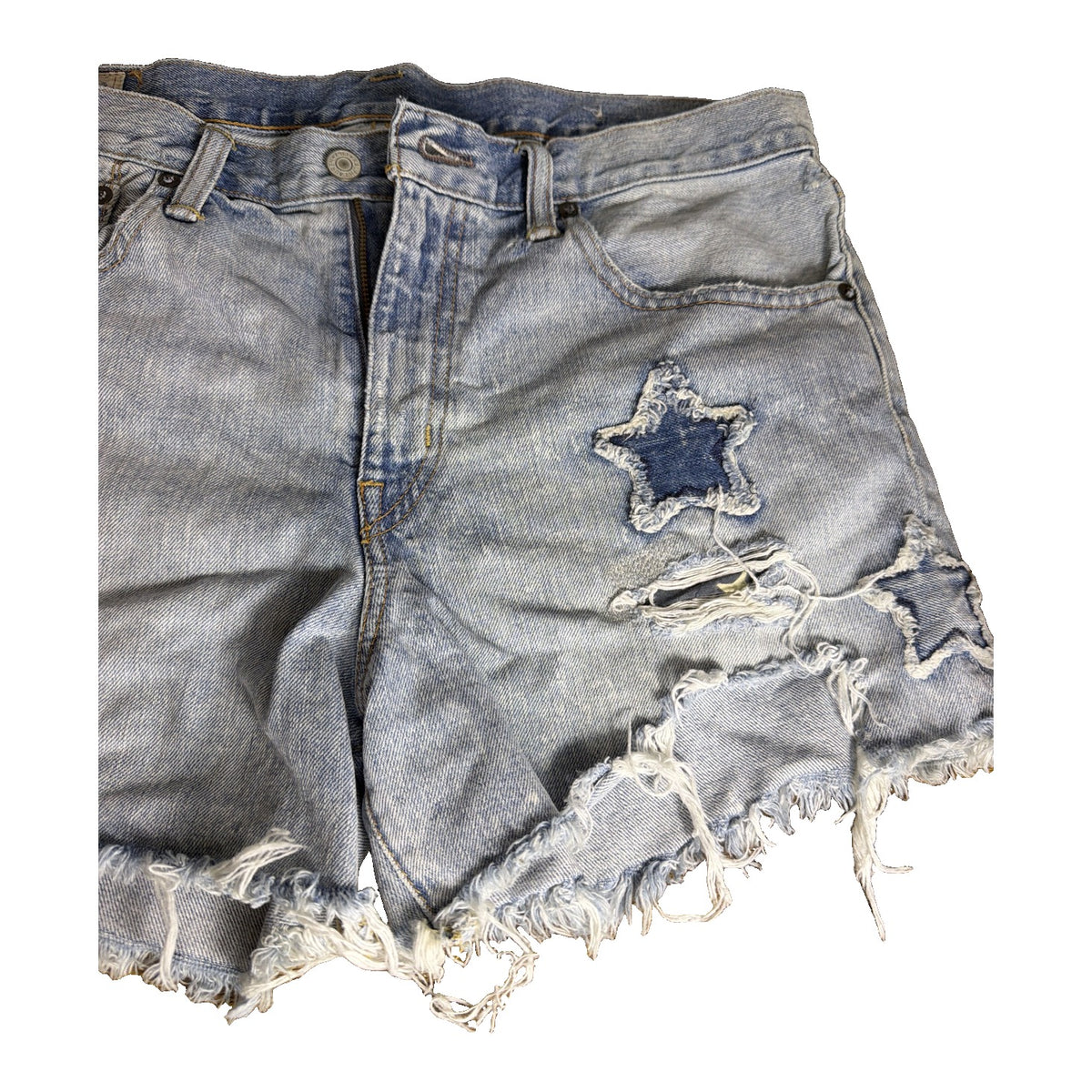 Polo Ralph Lauren women's distressed star patch light wash denim cutoff shorts, size 29, featuring frayed hems and star patch details.