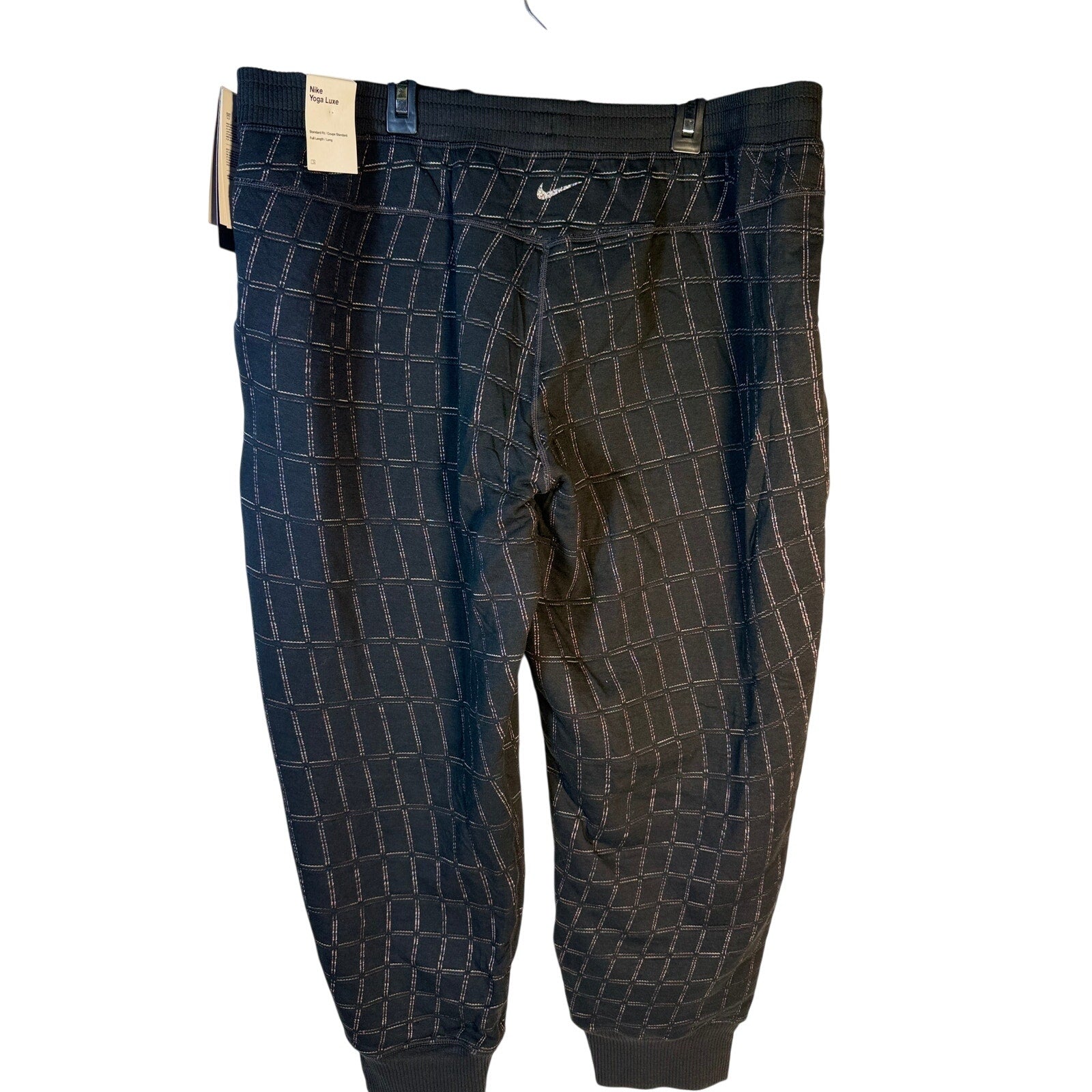 Nike Women's Yoga Luxe Grid Print Jogger Pants in black, featuring a comfortable fit and stylish design for training and casual wear.