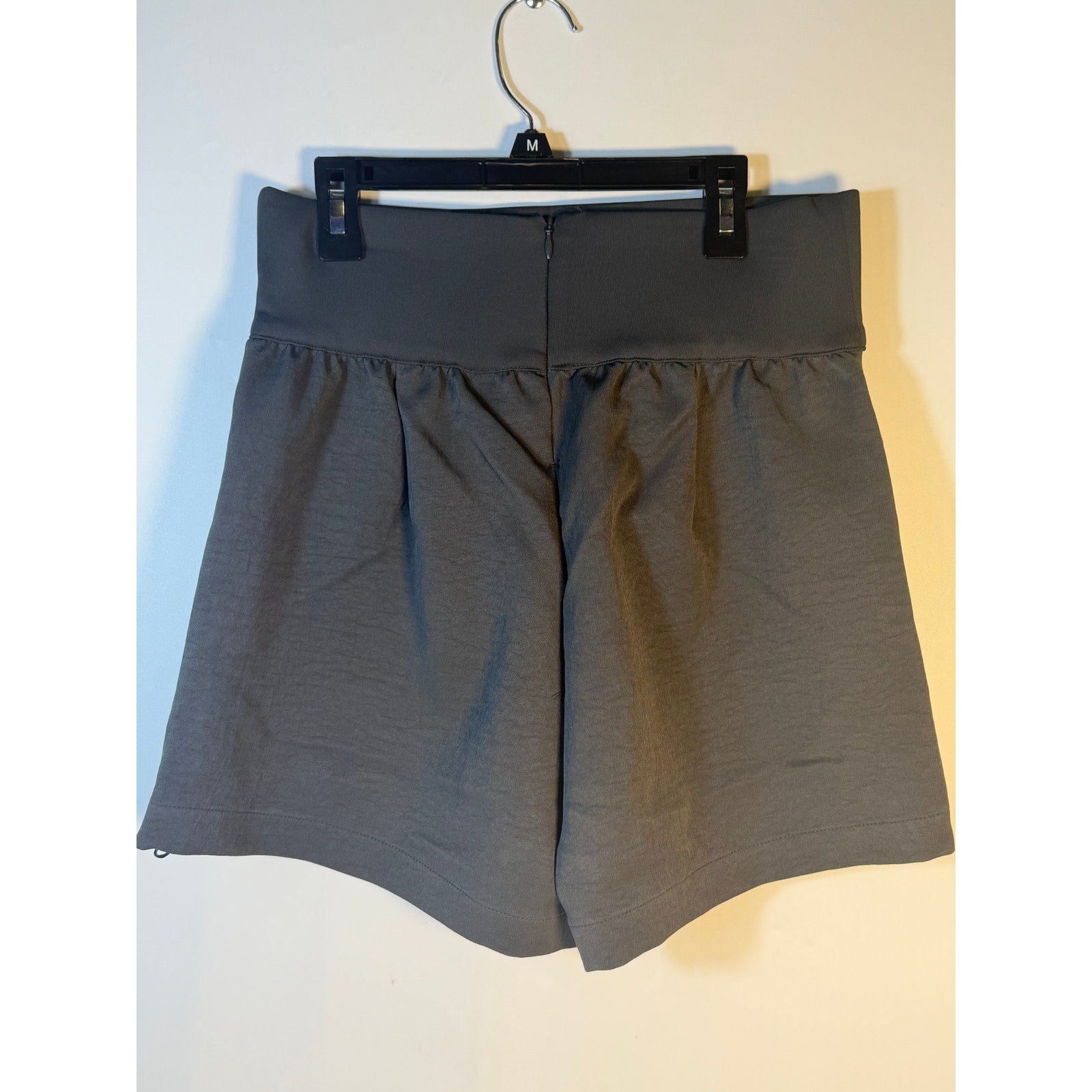 Nike Dri-FIT Flex Bliss Luxe women's shorts in gray, high-rise design, ideal for running and active wear, size medium.