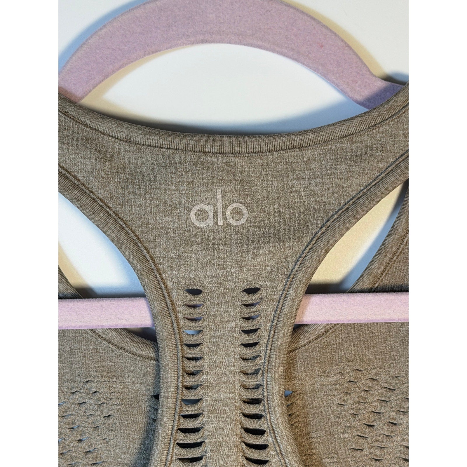 Gray Alo Yoga women's seamless open-knit racerback tank top, activewear, with a fitted, breathable design.