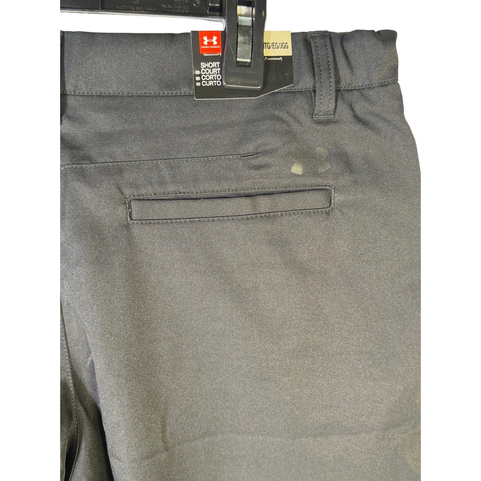 Youth boys' Under Armour Match Play golf shorts in black with performance stretch fabric, YXL size, new with tags.
