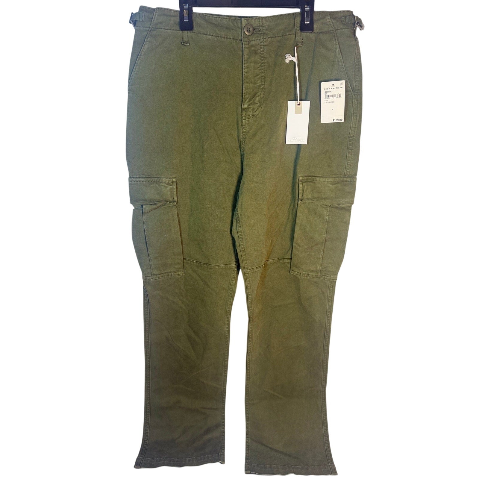Olive green Good American cargo pants in size 8, featuring fatigue style with multiple pockets and relaxed fit.