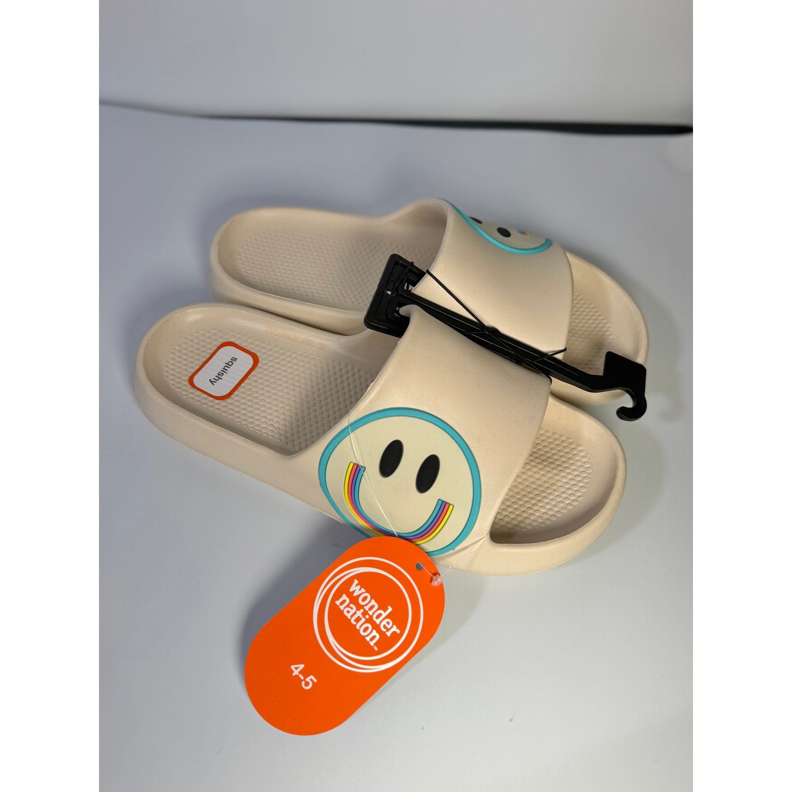 Wonder Nation girls cream smiley face slide sandals for youth size 4-5, featuring a playful smiley design and comfortable slip-on style.