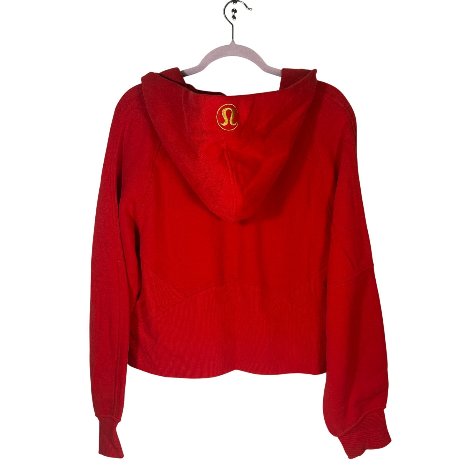 Lululemon women’s red scuba oversized full-zip hoodie in size M/L, front view showing the hoodie’s relaxed fit and gold accents.