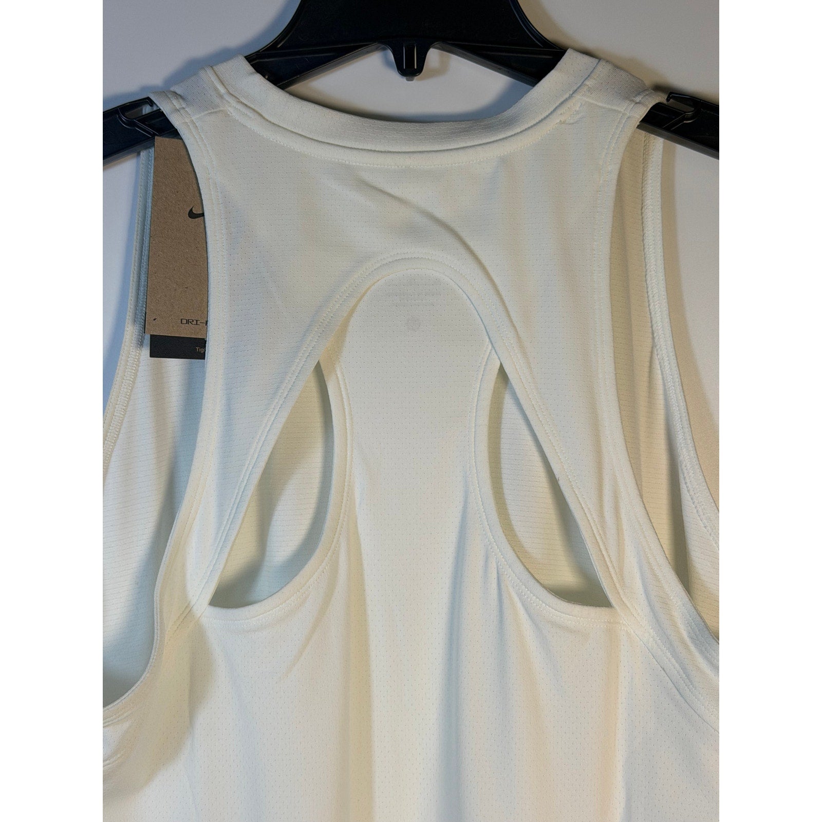 NikeCourt Dri-FIT tennis dress for women, sleeveless white sports dress in size XL, lightweight and breathable for active play.