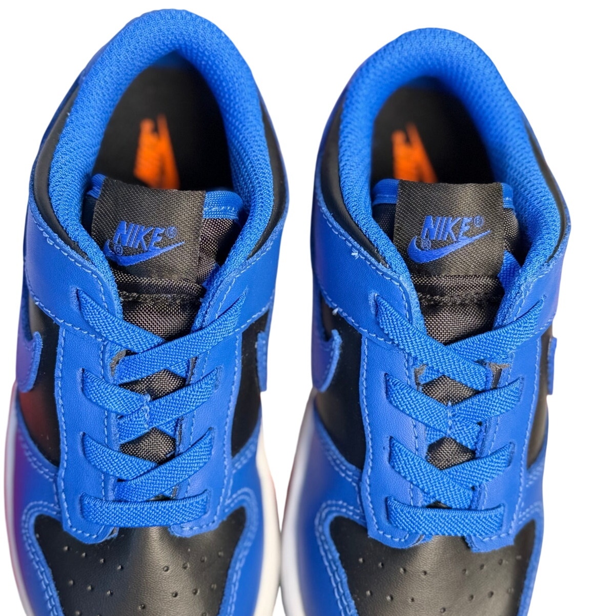 Nike Dunk Low GS sneakers for kids in royal blue and black, athletic shoes with stylish design and comfortable fit.