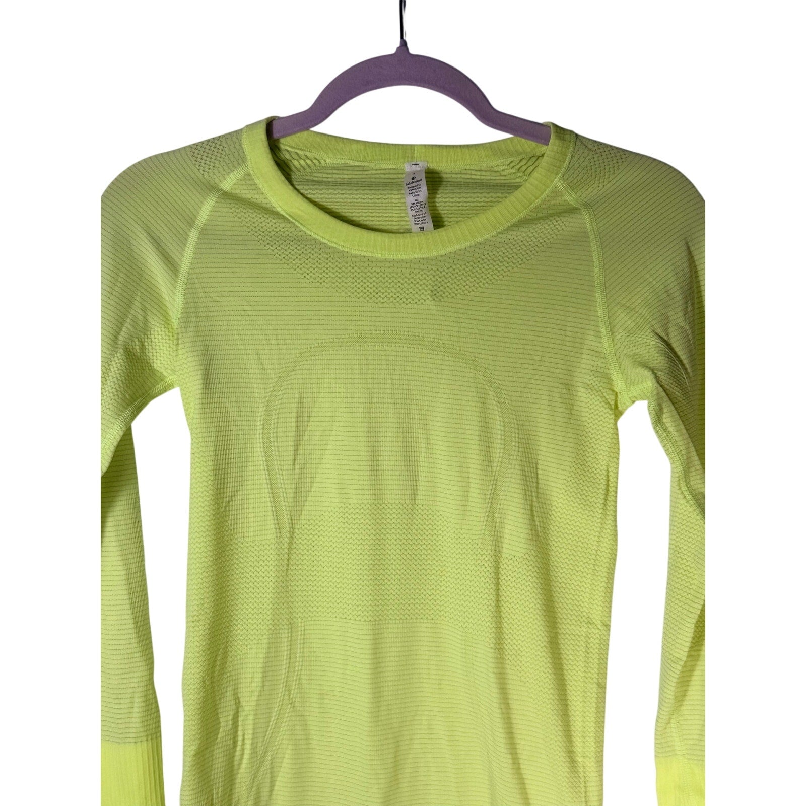 Lululemon Swiftly Tech long sleeve shirt for women, size 4, lightweight athletic top with breathable fabric, shown on a model.