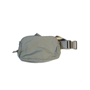 Lululemon Everywhere Belt Bag in light gray, crossbody waist pack with adjustable strap and compact handbag design.