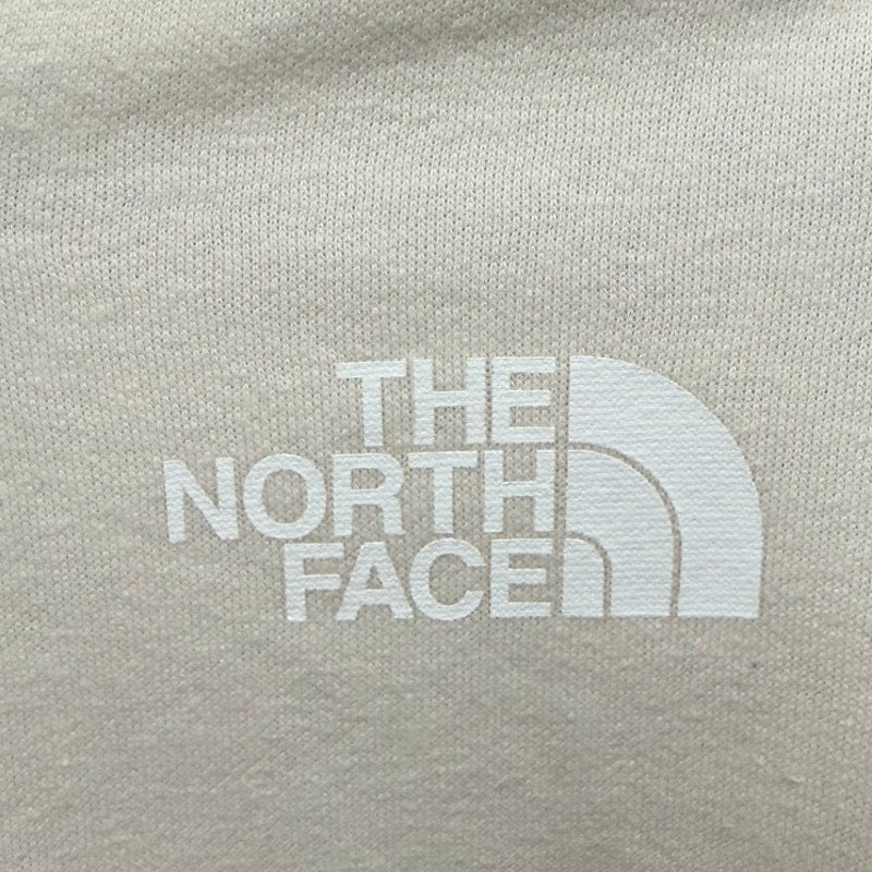 The North Face women's full-zip hoodie in Gardenia White, featuring a hood, front pockets, and The North Face logo.