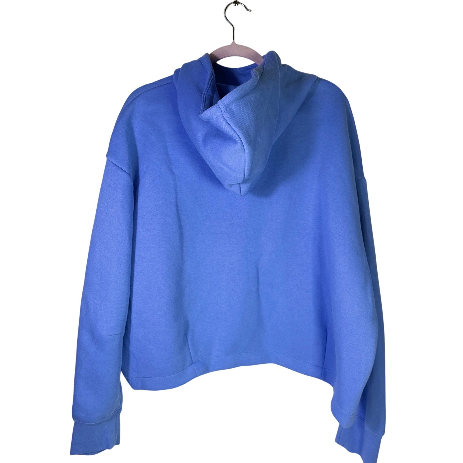 Nike Sportswear women's oversized blue fleece hoodie, size XL, with front pocket and hood, displayed on a plain background.
