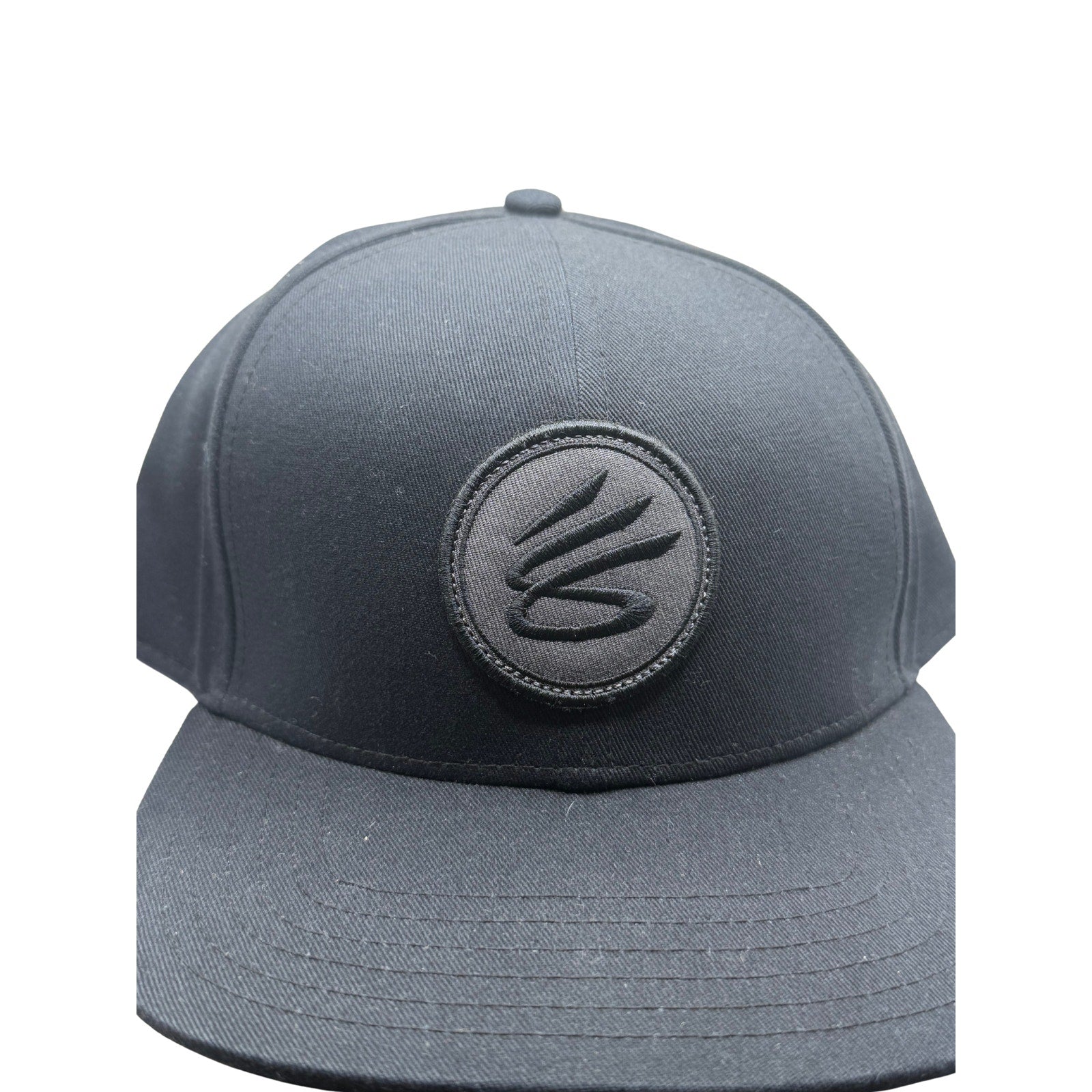 Curry Brand black snapback hat with adjustable strap, basketball cap style, front logo, one size fits most, new with tags