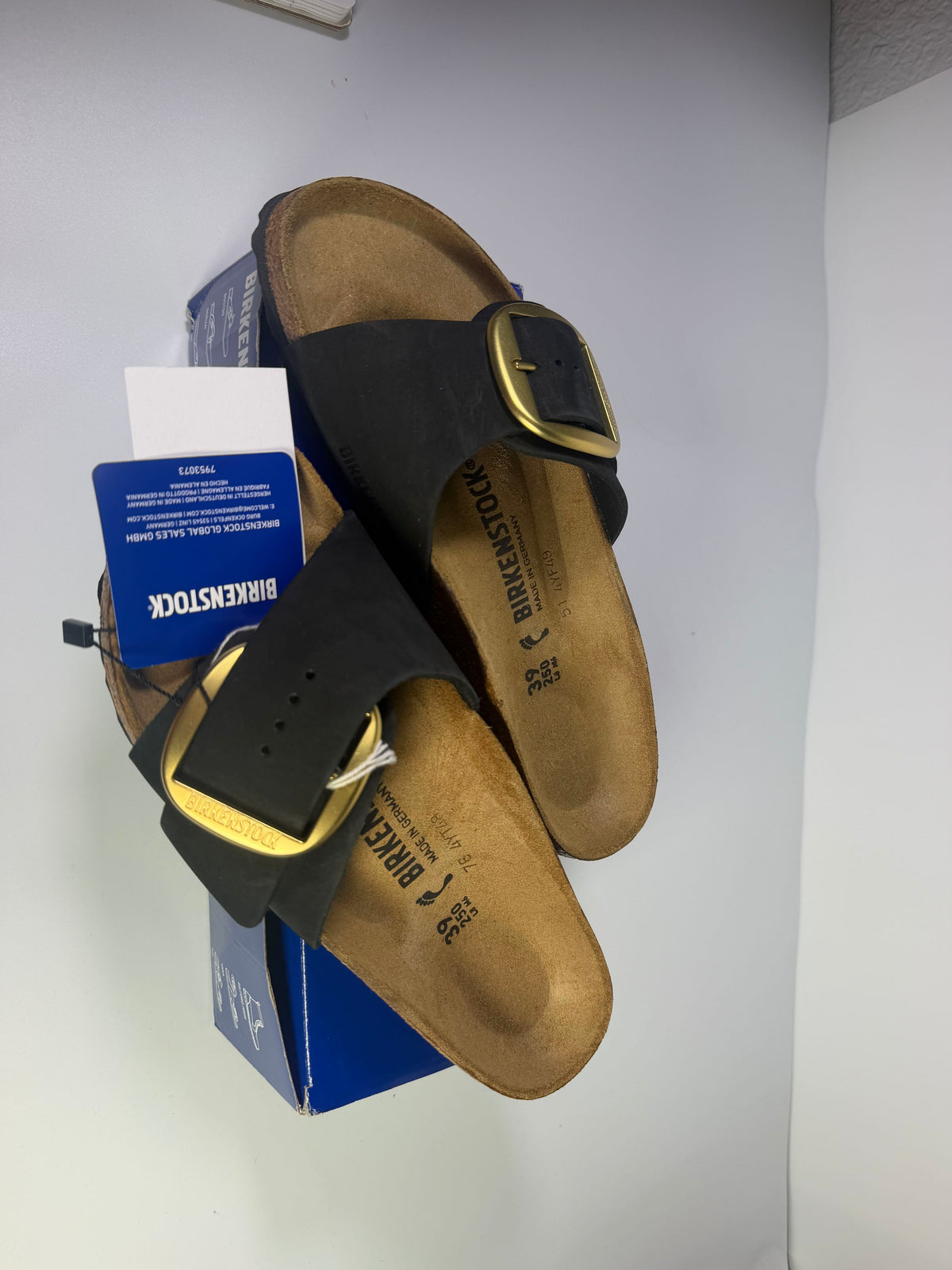 Black Birkenstock Madrid Big Buckle Sandals for women, US size 8, with wide strap and classic cork footbed.