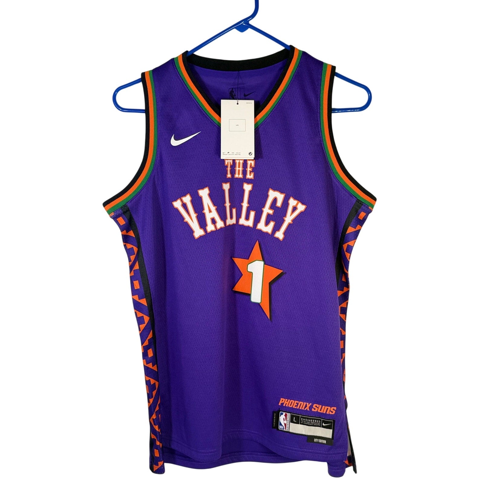 Nike Phoenix Suns Devin Booker #1 youth purple basketball jersey, size L 14/16, featuring Suns team logo and player name.