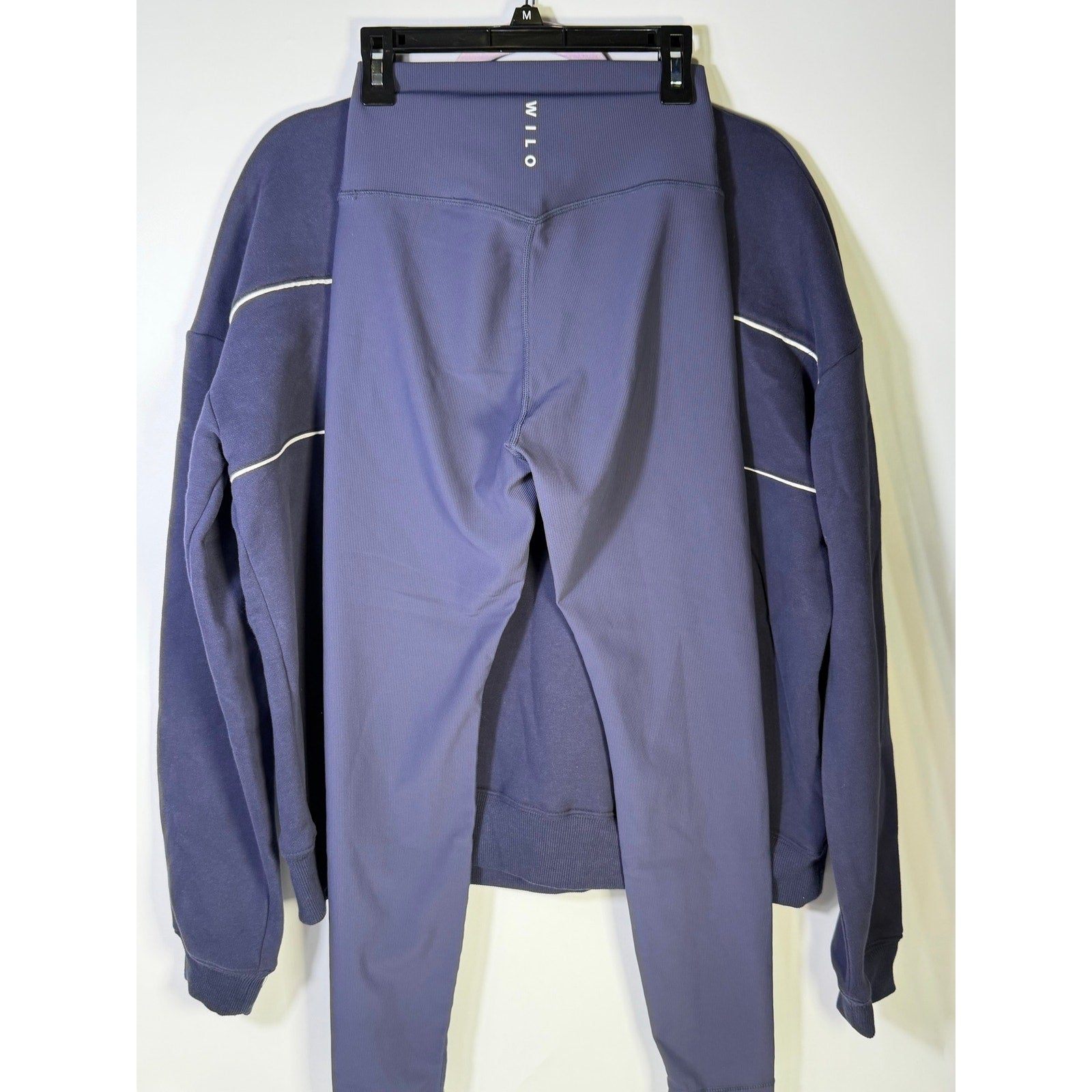 Wilo The Label women's navy sweatshirt and leggings set, size small, with matching comfortable fabric, front view.