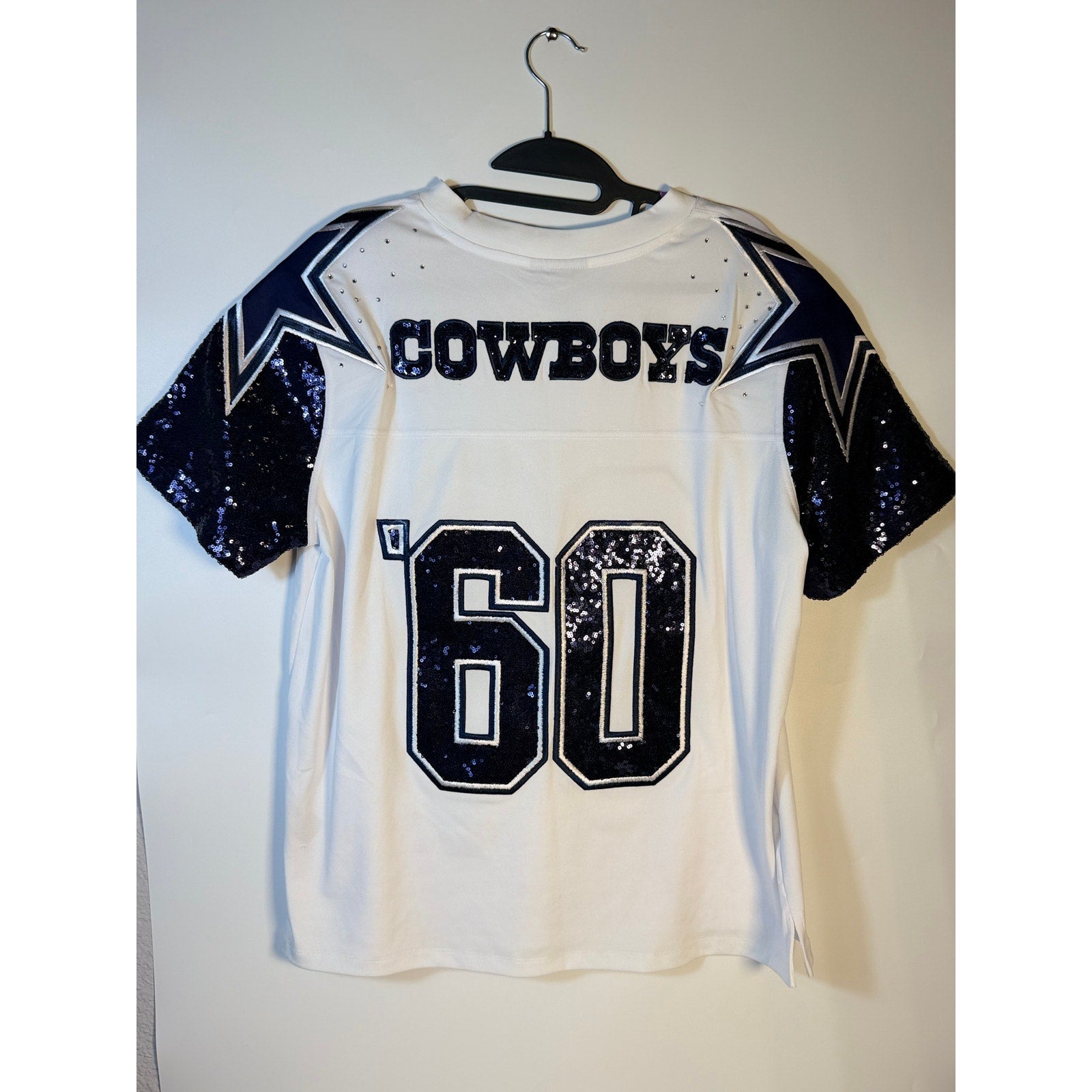 White Dallas Cowboys sequin NFL jersey for women by Wear by Erin Andrews, large size, front view showing sequined details.