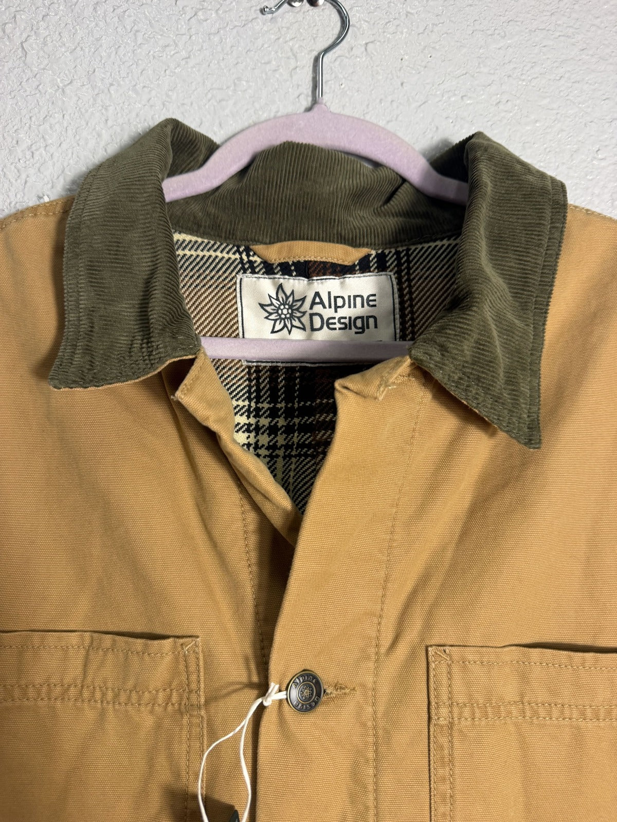 Alpine Design men's flannel-lined canvas chore jacket in brown khaki, size XL, with front pockets and durable stitching.