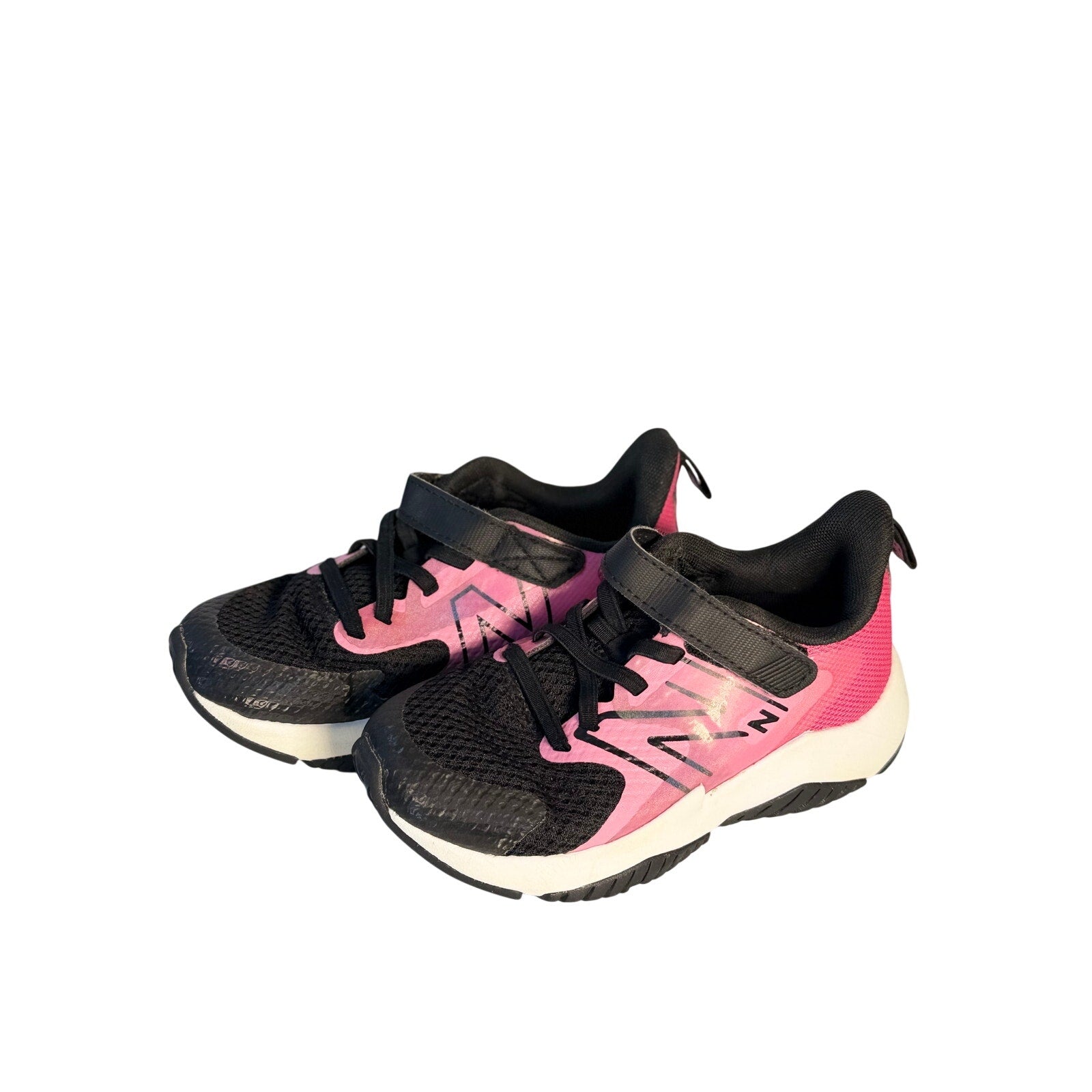 New Balance kids' black and pink athletic running shoes with hook and loop straps, size 11 US, for active children.