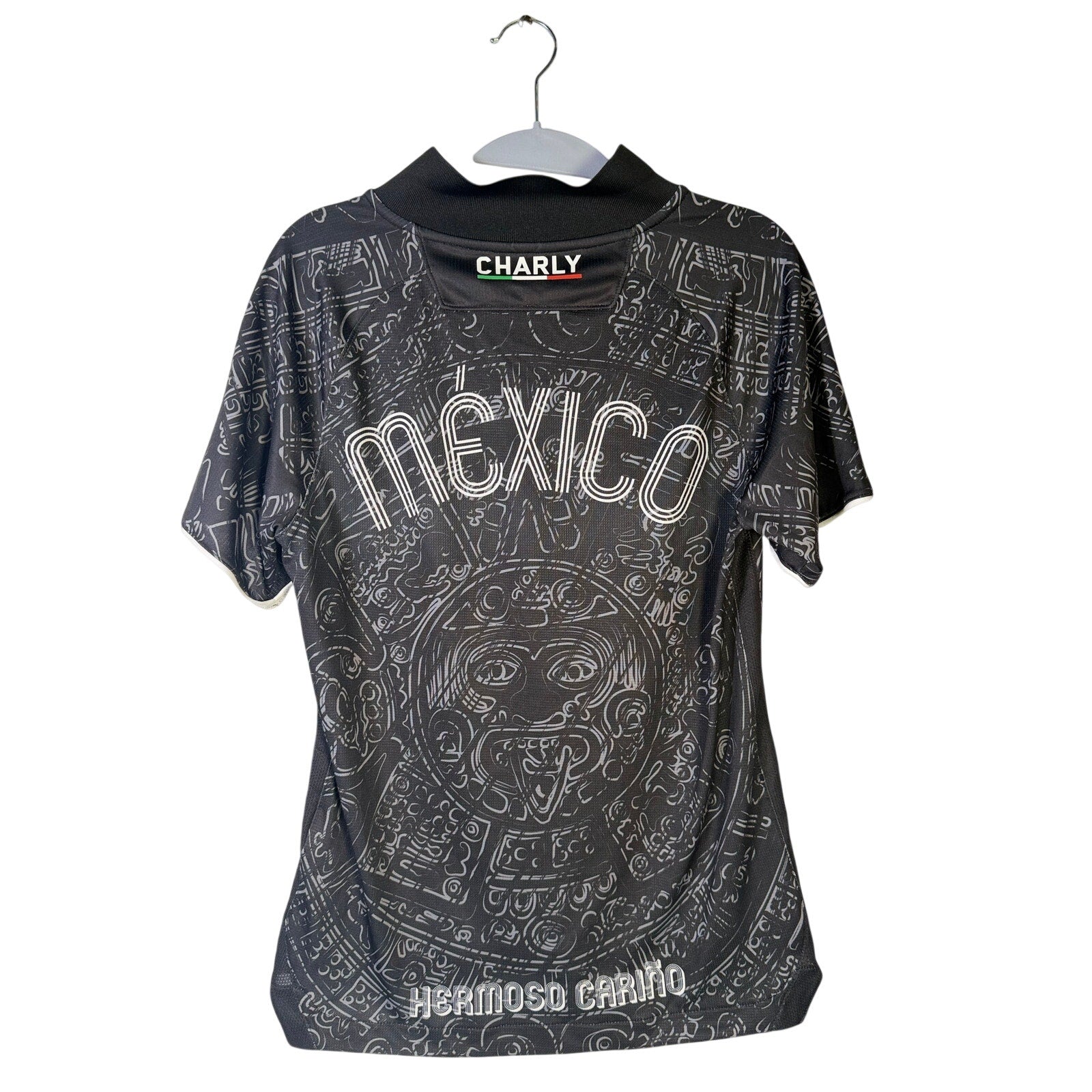 Men's black Charly Mexico Heritage SS soccer jersey with Aztec print, size XS, featuring short sleeves and team logo.